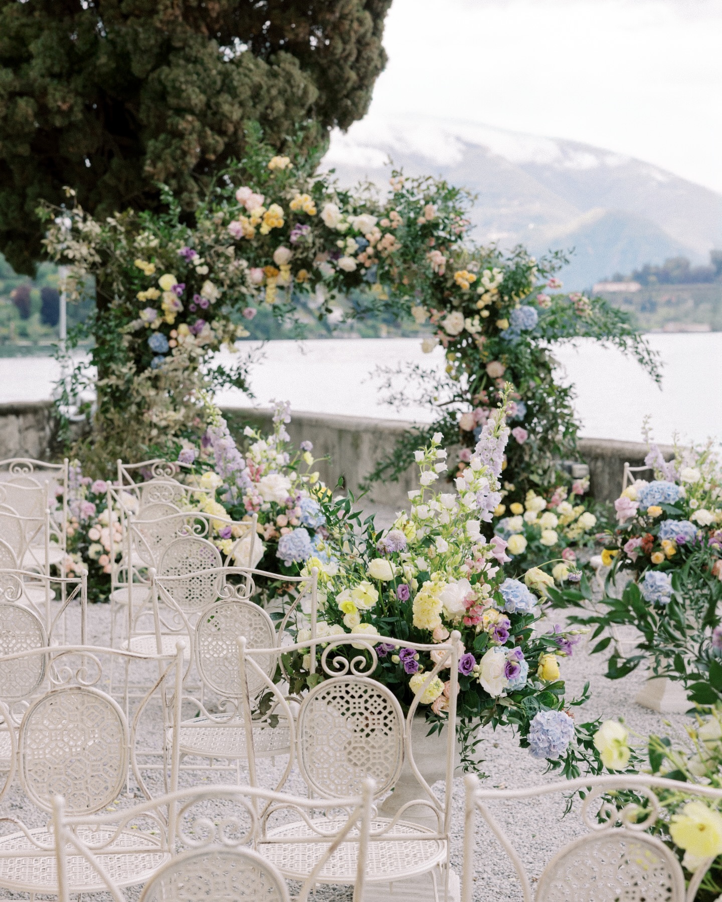 Floral design taking center stage at this Lake Como destination wedding dream venue, Villa Aura del Lago 🌸 💍
.
.
.
Photography @vsphotography_insta
Venue | Villa Aura del Lago | @auradellago
Workshop Host | AMV Retreats | @amv_retreats
Wedding Planning, Styling & Design | AMV Weddings | @amv_weddings
Educators | Sophie Kaye @sophiekayephotography | Andreas K. Georgiou @andreaskgeorgiou | Storybox Cinema @storyboxcinema
BTS Photography | Konstantyn Zakhariy | @konstantynzakhariy
BTS Videography | Storybox Cinema | @storyboxcinema
Florist | Flowers Living | @flowersliving
Cakes | Erzulie Cakes | @erzuliecakes
Furniture/Tabletop Rentals | Tableset | @tablesetrentals
Linens | Nuage Designs | @nuagedesignsinc
Stationary | Laura Elizabeth Patrick | @lauraelizabethpatrick
Hair & Makeup | Madeline Eleanor | @bymadelineeleanor
Couple | Anjali & Pooran | @anjali_1 @pooranvp
Ceremony Dress | Monique Lhuillier @moniquelhuillierbride by White House Bride @white_house_bride
Ceremony Veil | Enaura | @enaurabridal @enauraaccessories
Hair Accessories | All About Romance | @allaboutromancebridal
Ceremony Earrings | Megan Therese | @megantheresecouture
Ceremony & Reception Shoes | Bella Belle | @bellabelleshoes
Reception Dress | WONA Concept | @wonaconcept
Reception Earrings | White Jasmine | @whitejasmineaccessories
.
.
.
#lakecomo #lakecomowedding #lakecomoweddingplanner #lakecomoweddingphotographer #italywedding #italyweddingphotographer #villabalbiano #destiantionwedding #italy #francewedding #franceweddingphotographer #europewedding #weddingineurope #chateauwedding #fineartcuration #smpshareyourstory #destinationweddingphotographer #italyelopement #italyengagement #italyengagementphotographer