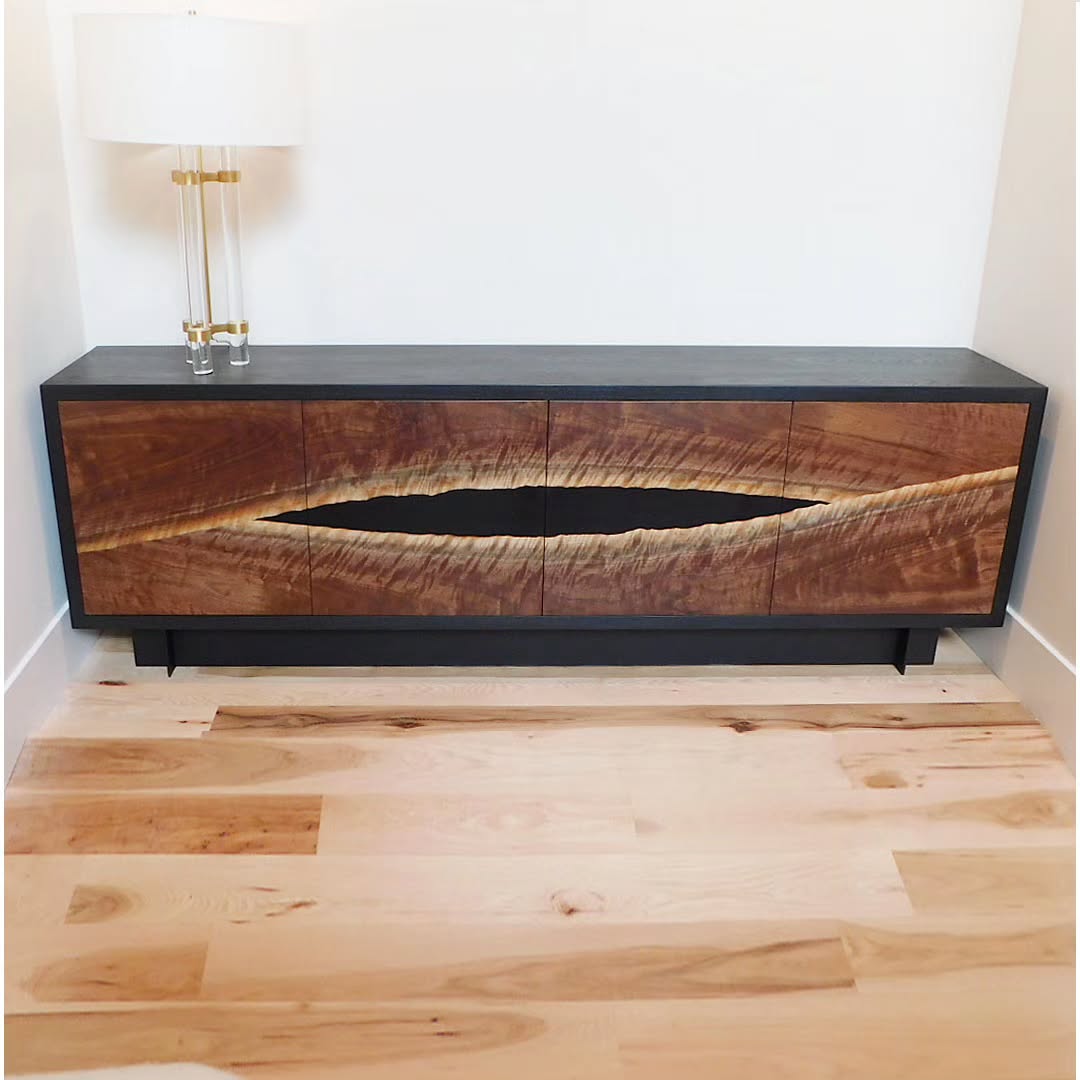 This coveted curly walnut slab was the perfect candidate for this custom console. We resawed bookmatched veneers to form the door panels. Housed in a blackened ash case with a steel base, it plays off our client's I-beam fireplace detail and other interior surroundings. Glad to have great repeat clients who let us run with our vision to produce pieces we love.
.
.
.
#customfurniture #interiordesign #credenza #console #blackwalnut #customdesign #steelwork #metalfabrication #woodworking #details #bespokefurniture #moderndesign