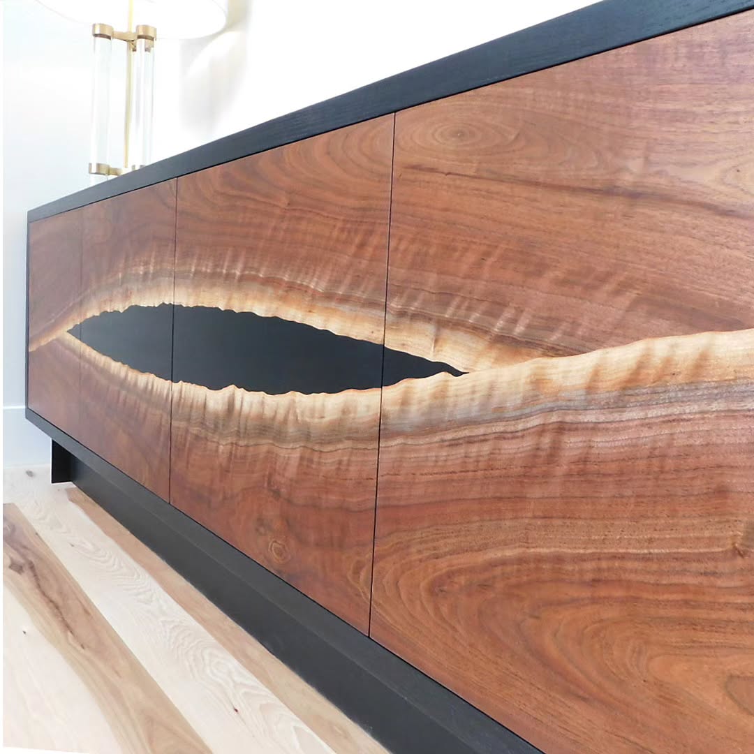 This coveted curly walnut slab was the perfect candidate for this custom console. We resawed bookmatched veneers to form the door panels. Housed in a blackened ash case with a steel base, it plays off our client's I-beam fireplace detail and other interior surroundings. Glad to have great repeat clients who let us run with our vision to produce pieces we love.
.
.
.
#customfurniture #interiordesign #credenza #console #blackwalnut #customdesign #steelwork #metalfabrication #woodworking #details #bespokefurniture #moderndesign @denverwoodslabs