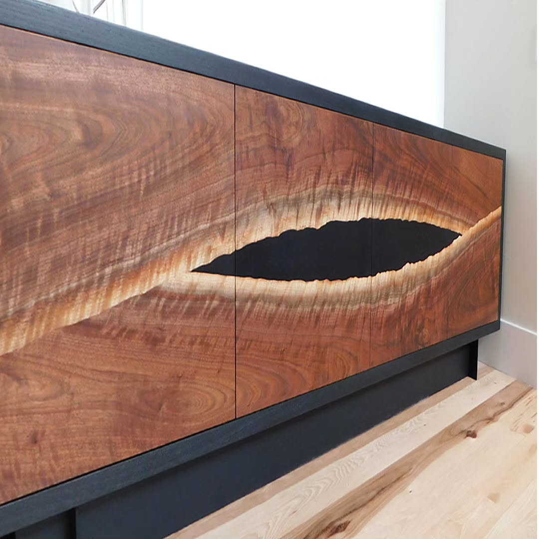 This coveted curly walnut slab was the perfect candidate for this custom console. We resawed bookmatched veneers to form the door panels. Housed in a blackened ash case with a steel base, it plays off our client's I-beam fireplace detail and other interior surroundings. Glad to have great repeat clients who let us run with our vision to produce pieces we love.
.
.
.
#customfurniture #interiordesign #credenza #console #blackwalnut #customdesign #steelwork #metalfabrication #woodworking #details #bespokefurniture #moderndesign