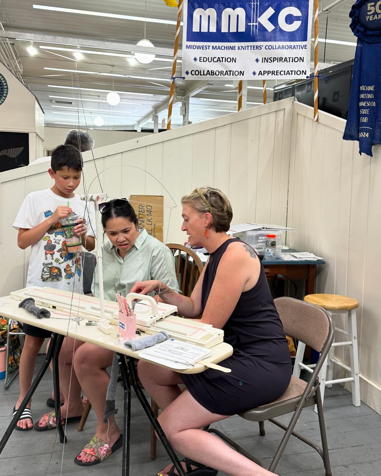 On August 26, MMKC had a blast demoing #machineknitting at the @mnstatefair in the Creative Activities Building! Curious onlookers gathered to observe our knitting machine in action, making it an engaging and fun experience for everyone.
Although it was the HOTTEST day of the Fair, the atmosphere was electric with creativity and enthusiasm. A highlight for us is always our interaction with fairgoers, giving everyone an opportunity to sit at the machine, and push the carriage. The joy, wonder and satisfaction on visitors faces as they knit was contagious. Kids were super excited to leave with their own knitted swatches (aka blankets for their mini stuffies).
We love our assorted hands-on demo days, during which we always manage to ignite a spark of interest in machine knitting. For many, it’s the first time they have ever heard of or seen a knitting machine. Our MN State Fair demo day beautifully captured the mission of MMKC: Education; Inspiration; Collaboration; and Appreciation. Until next year, we love you MN State Fair!!
#mnknitters #mmkc #knitallthethings #knitting #knittingaddict #nevernotmachineknitting #welovetoknit #knittersofinstagram #knitstagram #machineknittersofinstgram #machineknitter #machineknitstagram #sweaterknitter #machineknit #machineknitallthethings #collaborativeknitting #knittingwithfriends #machineknittingwithfriends #sweaterknitting #machineknitting #welovetoknit #ribbonwinner #sweepstakes #everyonesawinner