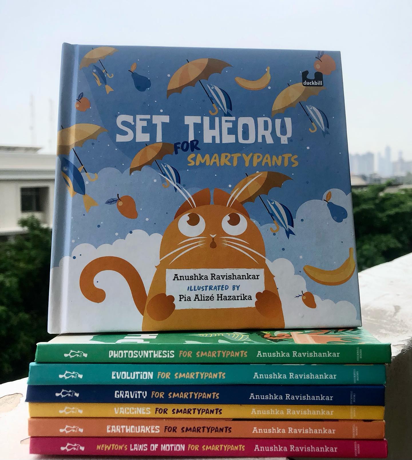 The Smartypants Series
By Anushka Ravishankar
Illustrated by Pia Alize Hazarika
Published By Duckbill @penguinsters
This series of non-fiction books manages to tackle some pretty heavy concepts in a way that’s fun, engaging, and totally irresistible for little readers. Writing science for kids can be a tricky business—how do you take all these big, brain-busting ideas and make them click for a child? Well, Anushka Ravishankar has absolutely nailed it in the Smartypants series.
So, who exactly is Smartypants? Oh, just the coolest cat in town! He’s cheeky, confident, and always ready with a quick quip. His witty, sometimes even existential questions will not only have you rolling on the floor laughing (yes, actual ROFL moments) but also help you wrap your head around the concept at hand. It’s education with a side of giggles.
Each book eases you into the subject with a slow build, so you get the gist early on, but there’s a treasure trove of info that keeps even older readers hooked. Smartypants isn’t just for the little ones—it’s for anyone who loves to learn while having a blast.
We like the entire series, but some of our absolute favourite books from this series are Photosynthesis for Smartypants and Set theory for Smartypants.
Perfect for kids aged 4+.
The Books we have read in this series are as below
Photosynthesis for Smartypants
Gravity for Smartypants
Evolution for Smartypants
Set Theory for Smartypants
Vaccines for Smartypants
Earthquakes for Smartypants
Newton’s Law of Motion for Smartypants