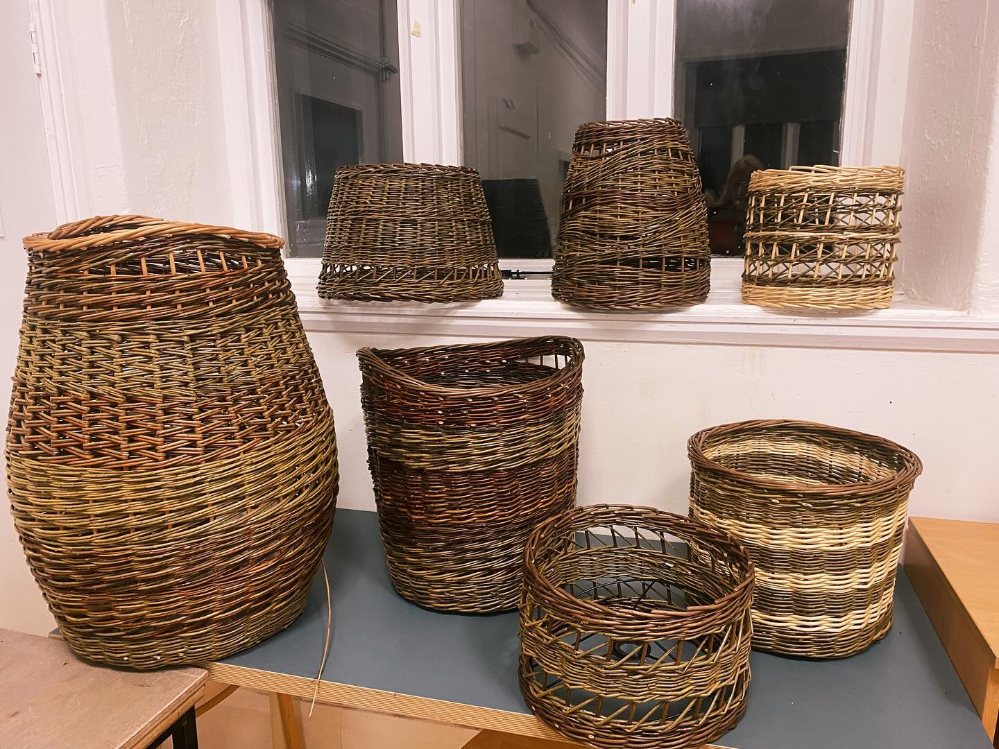 Celebrating 🎉
8 beautiful weeks of teaching 6 students from my ongoing basketry group. We meet once a week for 3 hours and this term have focussed on learning different weaves from traditional English and French randing and their variations to Irish weave and zigzag weave.
They spent the first 5 sessions weaving a basket and the last 3 sessions, a lampshade. It’s been so much fun for me to see the skills grow and witness that learning and excitement as they practice skills which can be applied to their current and future work.
We had a few extra beauitiful moments where I switched off the lights and used a phone torch placed inside a lampshade to see how the weaves looked . Many oohs and ahhs! It reminded me of fireworks night!!
Apologies that my photography is always secondary to my teaching so no photos of this , but trust me, they looked awesome!! 😍Clever students 👏🏻
I’ll be adding new courses to my website for 2025 (including lampshades) by the end of the week. If you’d like to be first to know what’s coming up, and join me in this basketry journey, sign up to my monthly newsletter on the website, link above in the bio ⬆️