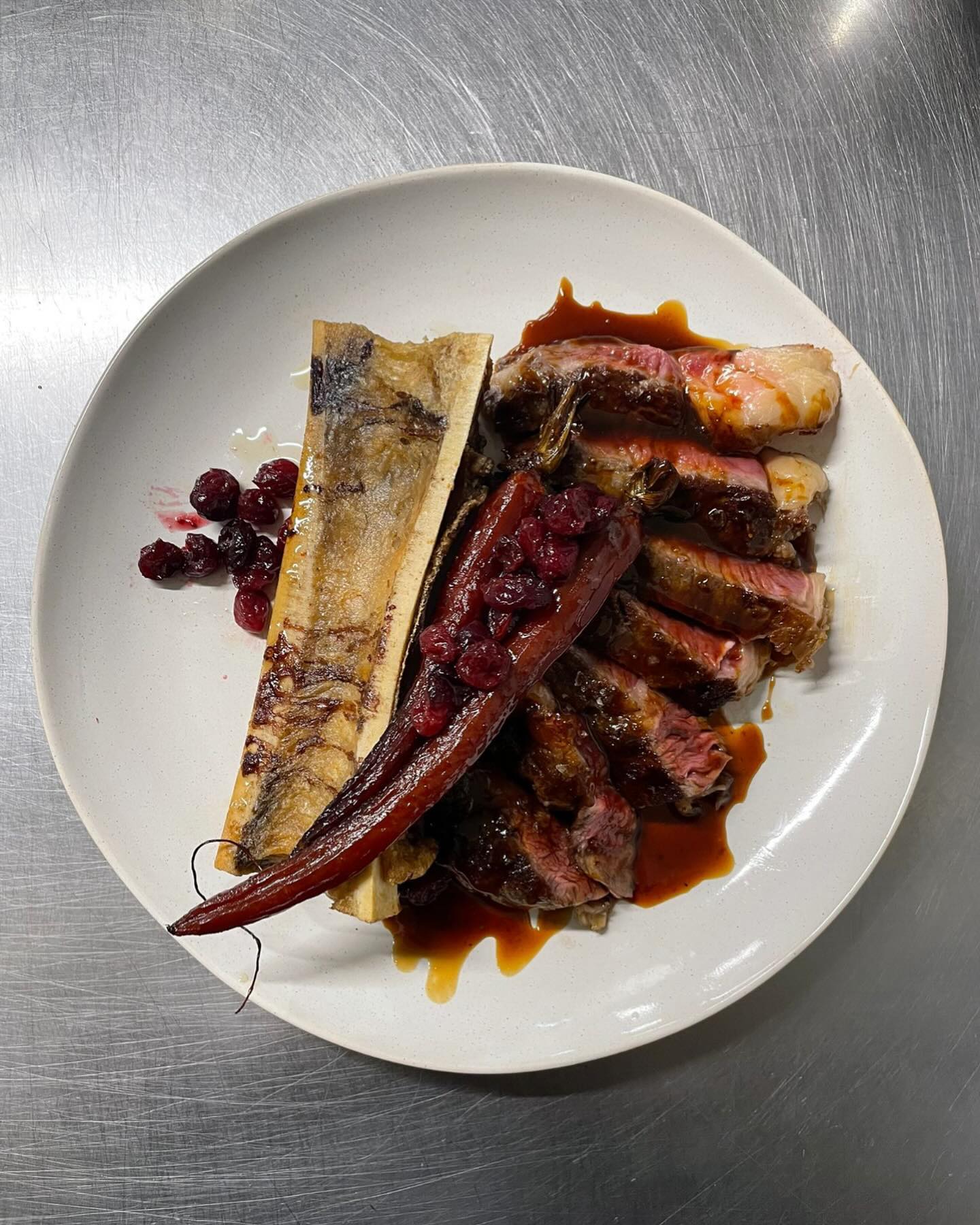 Rib eye, jus, port baked carrot, roast bone marrow