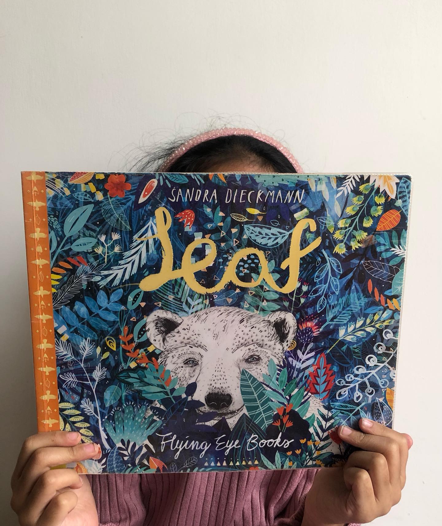 Leaf by Sandra Dieckmann
A polar bear unexpectedly arrives on an island, and the local animals, unsure of what to make of him, react with fear and suspicion. The bear’s odd behavior, like covering himself with leaves and leaping off cliffs, only adds to their unease.
Yet, among the animals, the crows urge everyone to come together and communicate with the bear rather than shun him. When the bear nearly drowns after one of his reckless leaps, the crows come to his rescue, and his heartbreaking story unfolds—a tale of loss, struggle, and the devastating impact of climate change on his kind.
Leaf is a poignant exploration of the challenges faced by polar bears—emblematic of the broader environmental crisis. It highlights the shrinking ice caps, disappearing habitats, and the dire consequences for wildlife. While the book raises awareness about climate change, it also delivers an important message about acceptance and inclusion, reminding young readers of the power of compassion and understanding.
Even if none of the above themes work for you, the artwork alone makes this book worth owning. Sandra Dieckmann’s illustrations are exquisite, each page a delicate work of art that could easily be framed and displayed. It is lovely and tragic.
Ideal for children aged 3 and up