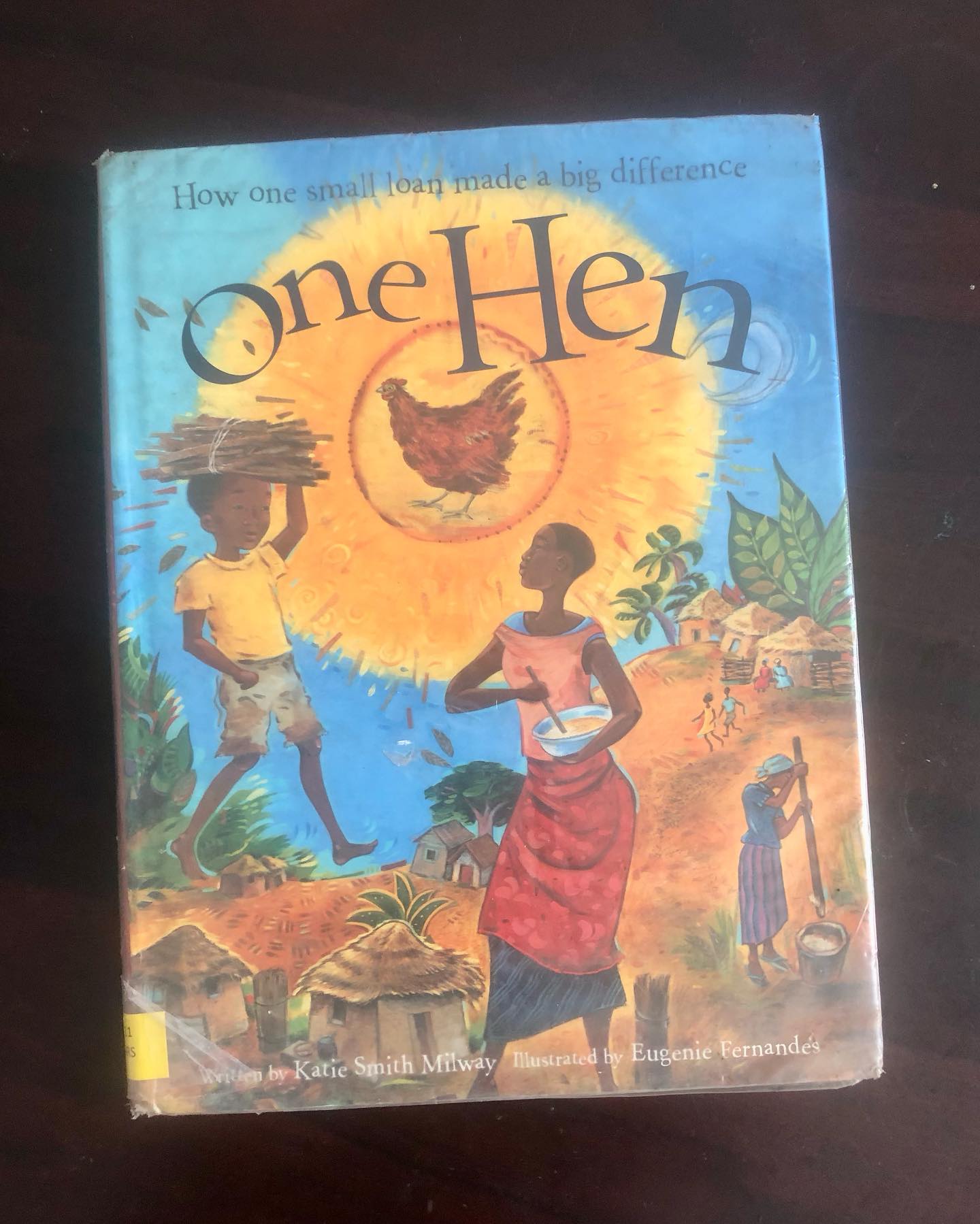 One Hen
by Katie Smith Milway
Illustrations by Eugène Fernandes
Inspired by the remarkable life of Kwabena Darko, One Hen tells the uplifting story of Kojo, a young boy who transforms a small loan into a life-changing venture that benefits not just himself but his entire community.
The story begins with Kojo having to drop out of school due to financial hardships. When his mother receives a small loan to support her business, Kojo is entrusted with a tiny portion of it. He uses this modest amount to buy one hen—a single decision that marks the start of a transformative journey. Kojo begins selling eggs, reinvesting some profits to grow his flock. By the end of the first year, he owns 25 hens and runs a thriving business.
Empowered by his newfound independence, Kojo funds his education, builds a successful business, and ultimately drives positive change in his village. The book concludes with an insightful author’s note that delves into Kwabena Darko’s story and the broader impact of microloans in empowering communities worldwide.
This inspiring tale teaches children that even the smallest beginnings can lead to great achievements when paired with hard work and determination. The vibrant illustrations by Eugène Fernandes beautifully complement the story, capturing its cultural essence and bringing Kojo’s world to life.
One Hen is ideal for children aged 6 and up, offering a heartwarming lesson in perseverance, entrepreneurship, and community impact. A must-read for kids and a meaningful addition to any library!
