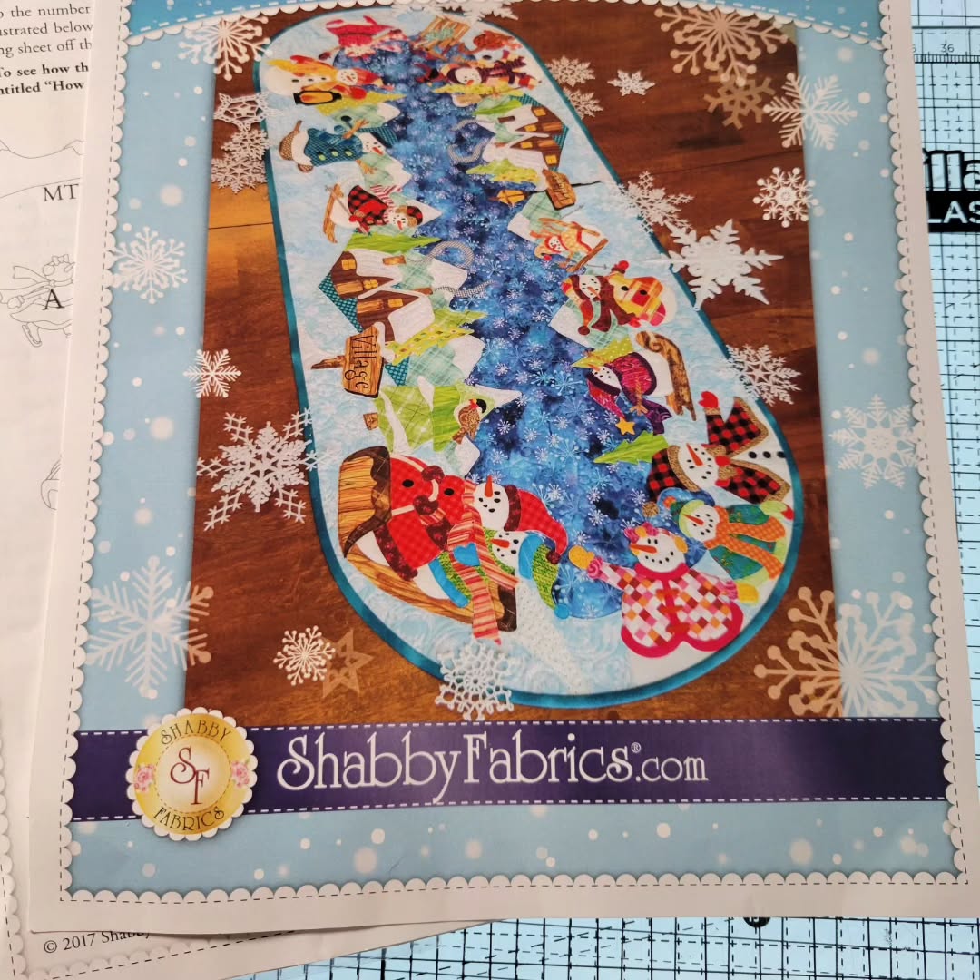 Holiday table runner by Shabby Fabrics. I love this pattern. There are a lot of pieces, so I would suggest getting the laser cut applique kit. I also used the CutterPiller light box for fabric placement. I have everything fused down and ready to be sewn!
#shabbyfabrics #shabbyfabricssnowmanvillage #appliquetablerunner #cutterpillarlightbox