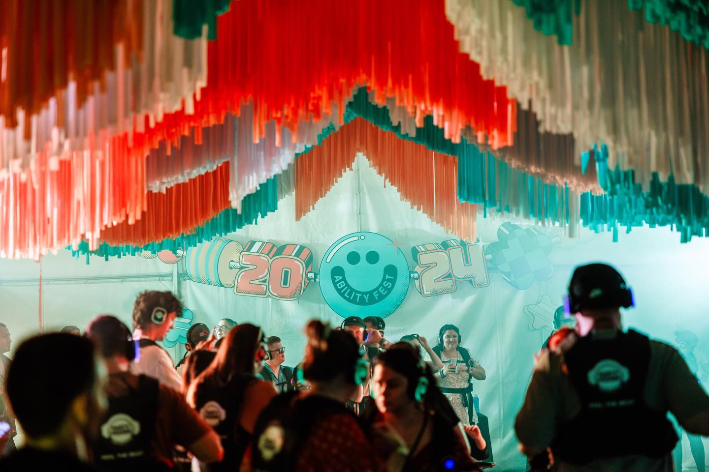 Back in October we delivered a colourful, friendship-bracelet inspired set for the Ability Fest Silent Discos across Victoria and Queensland. We utilised the hero elements from their branding by incorporating bold bright hues throughout fringing in the ceiling, large format cutout shapes to dress the front of the marquees and a large friendship bracelet cut out for the back of the marquee welcoming punters into the space 🌟