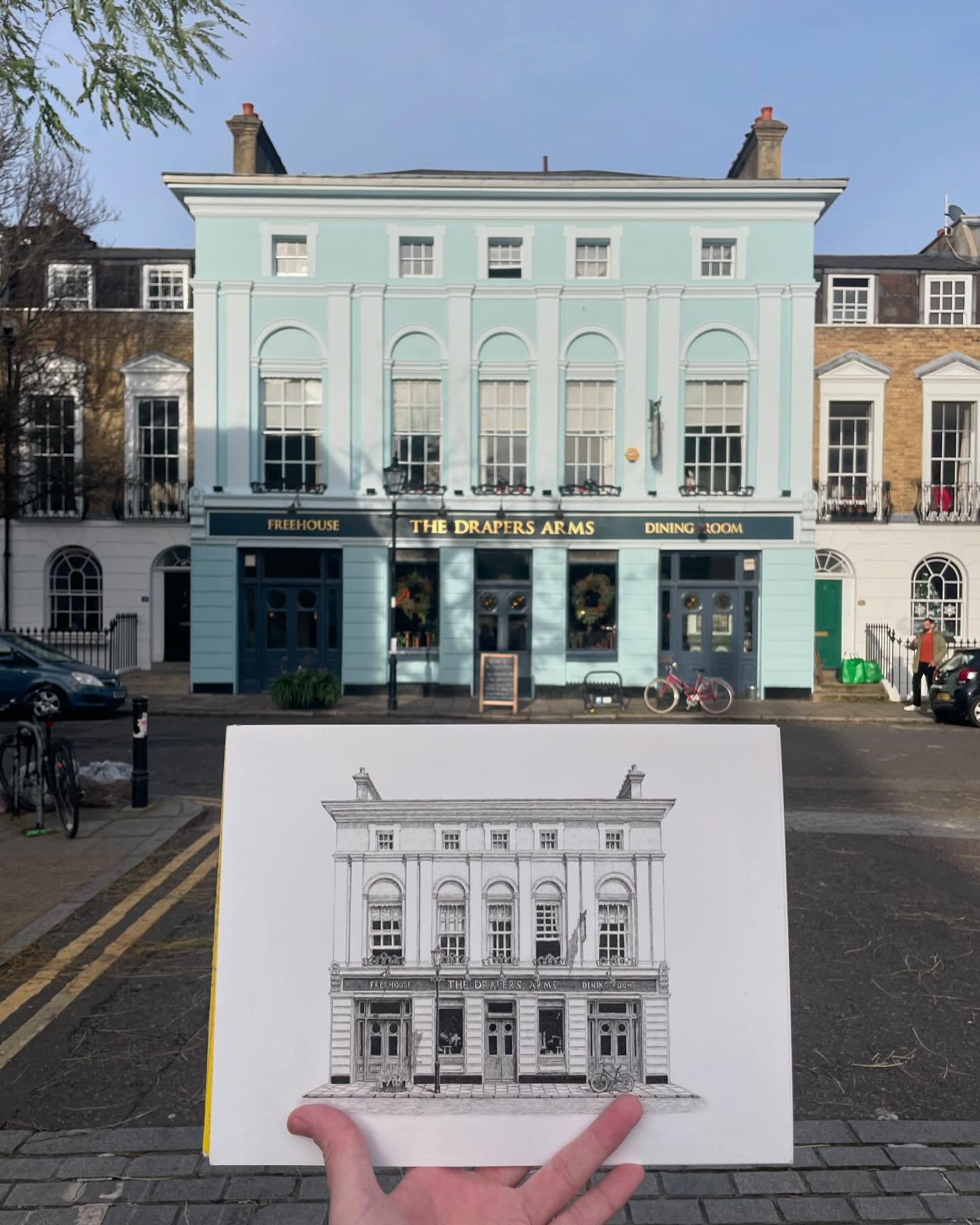 The Drapers Arms, Barnsbury Street
Itās back!! I initially drew this wonderful pub back in 2021, but after selling out of the limited set of prints a couple of years ago, Iāve had so many requests to redraw it.. so here it is!
My style has shifted so much since then, I was intrigued to see how it would turn out. The last photo included shows the 2021 version for comparison, for which I used a 0.1 pen, an angled perspective and a cross-hatching style. Whilst the new version was drawn using a 0.03 pen, a straight on perspective (ma fave) and a much lengthier and detailed shading process.. for those who care to know!
I donāt usually like to redraw the same place, but once enough time has passed I honestly canāt think of a better way to test how your drawing style has developed and evolved. Iād encourage yāall to try it!
@thedrapersarms
#sketching #process #learning #progress #drawing #londonlife #inkdrawing #artwork #pendrawing #practice