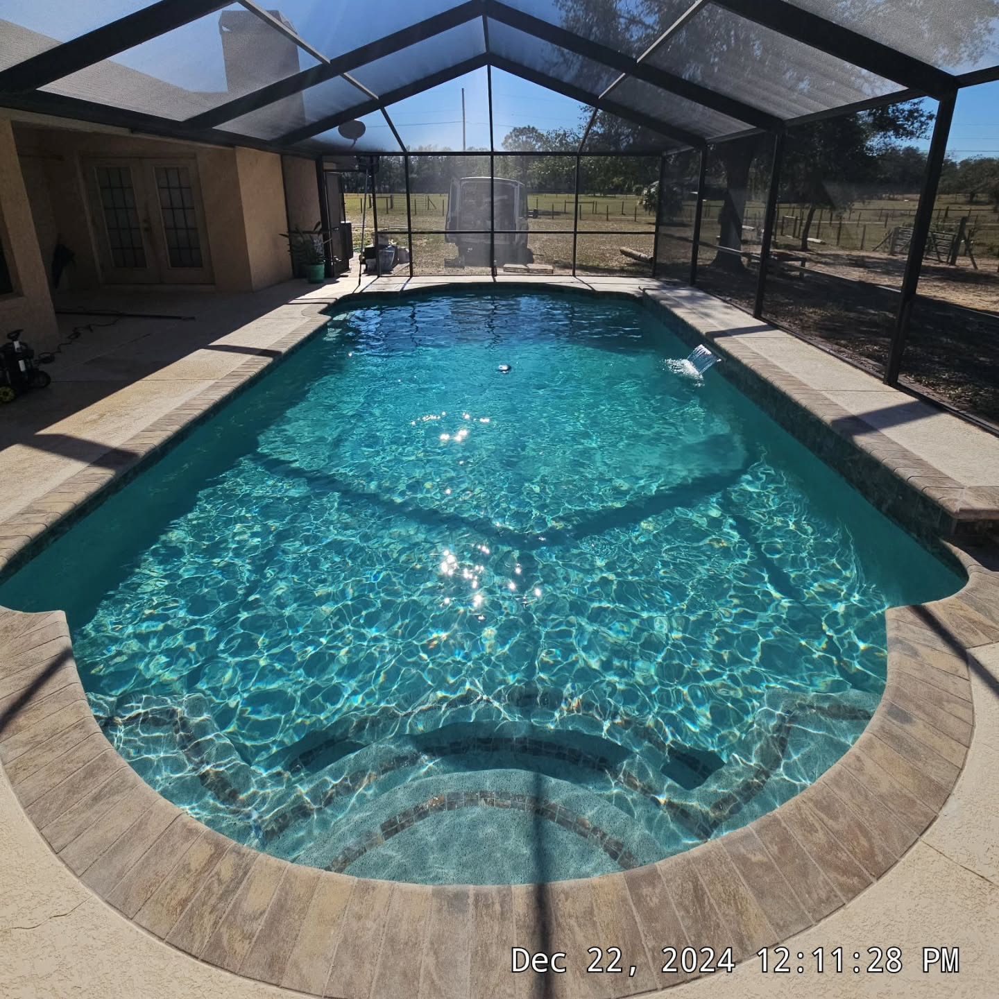 Finished Product, Preparation, & Before. A complete tear out was required to bring this pool up to spec. Complete removal of old surface, tile, coping, and then new tile, coping, and Pebble Finish. Brand new equipment pack installed also. 
The photos really don't do justice for how pretty this combination of tile, coping, and plaster came out. 
Freestone Emerald Island Pebble Plaster, Aquabella Nepal Himalaya Tile, with Belgard Rio Coping.