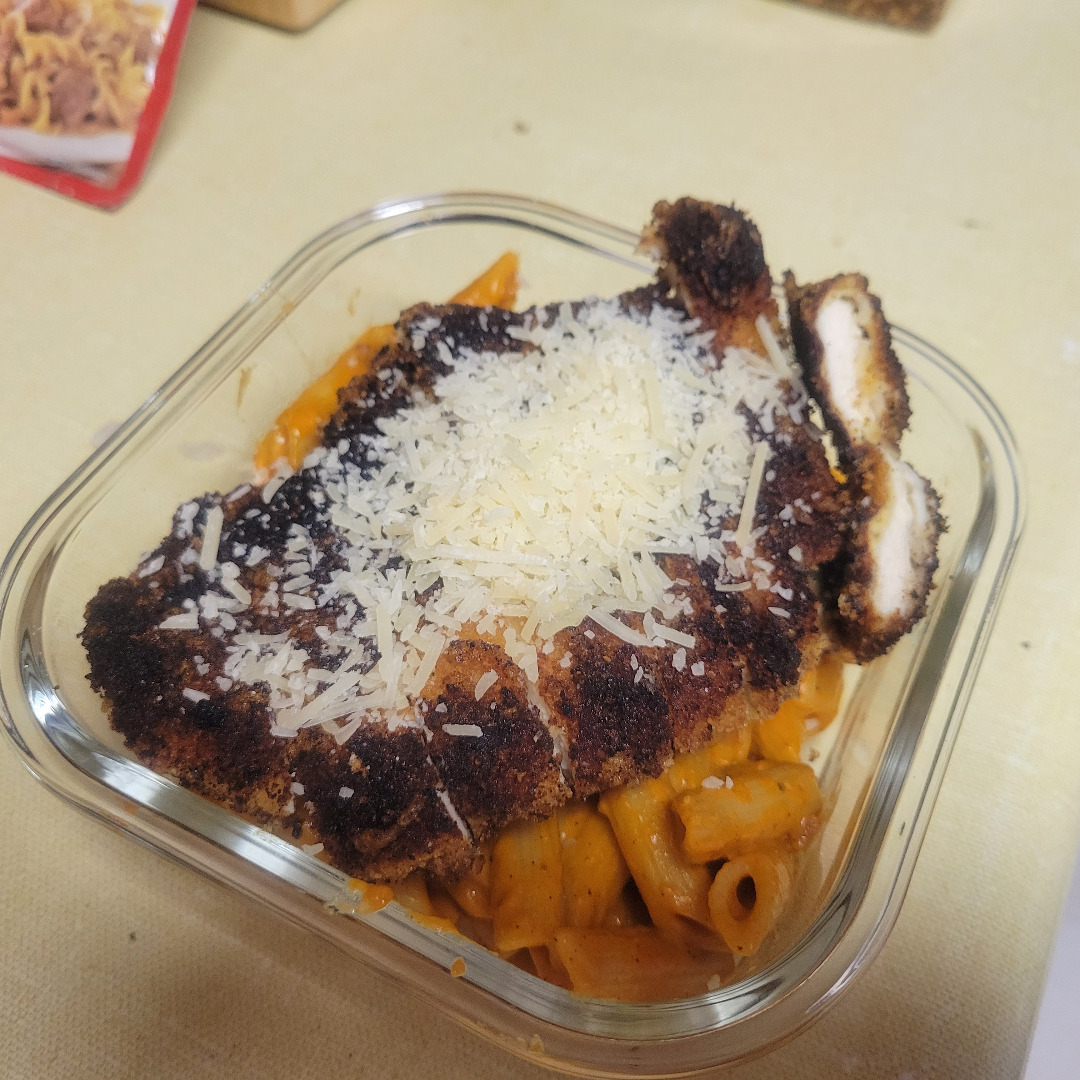 Penne ala vodka and slightly burnt parmesean chicken.
Cooking is fun!