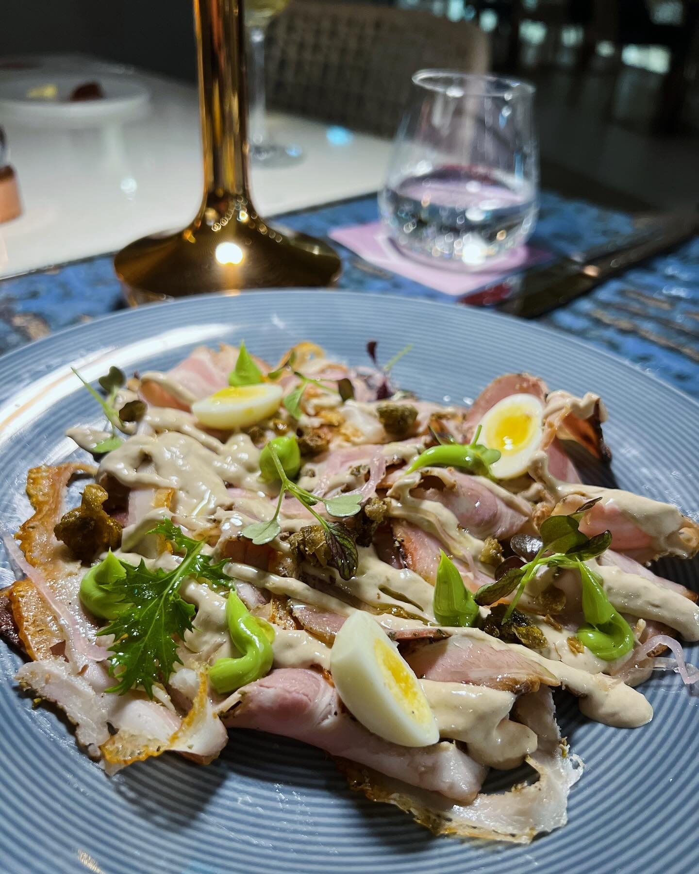 Dinner with Zafrana 2021 at SEED Restaurant
Continuing our journey of dining experiences with Markus Divinus wines, we visited SEED Restaurant—a culinary gem known for its creative dishes and welcoming ambiance. This time, we paired the experience with Zafrana 2021, a wine that captures the essence of the Maltese terroir while balancing freshness and complexity.
The evening began with a Caprese Salad, showcasing the finest local ingredients, and a slow-roasted porchetta tonnato—a modern take on the classic vitello tonnato. The crispness of the Sauvignon Blanc in Zafrana 2021 cut through the richness of the dish, while the Chardonnay added layers of depth, creating a harmonious balance. Notes of garrigue and a touch of saline minerality brought out the unique character of the wine.
The highlight of the evening was the veal Milanese, topped with Cantabrian anchovies. The bold flavors of the dish paired seamlessly with the wine’s vibrant acidity and refreshing texture. The local Girgentina grapes added a distinct sense of place, while the stainless steel production preserved the purity and brightness of the flavors, celebrating Malta’s unique terroir.
Zafrana 2021 and SEED Restaurant proved to be a perfect match. The combination of thoughtful dishes, great wine, and relaxed conversation made for a memorable chapter in our Wine & Dine Journey—a true celebration of Mediterranean flavors paired with local winemaking expertise.
#MarkusDivinus #Zafrana2021 #SEEDRestaurant #WineAndDineJourney