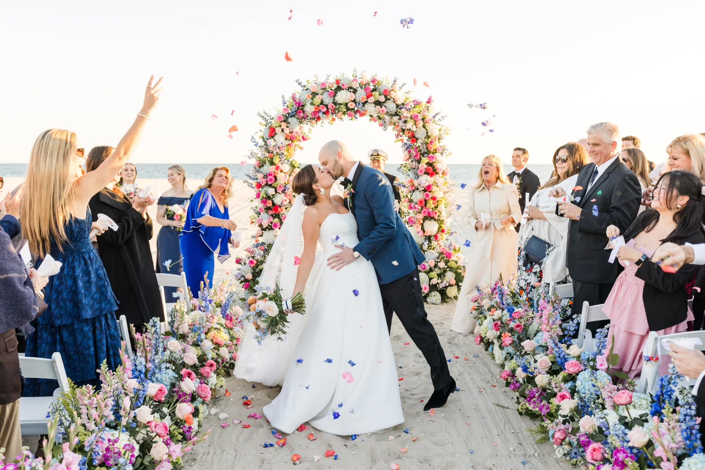 Your wedding ceremony is a great place to focus your floral investment and wow your guests. Plus lots of ceremony flowers = lots of flowers to repurpose to the reception. We design pieces meant to be used in both places and our team will stay on site to move them after the ceremony. Whether we create impact with color, scale, or both, the key is to create a beautiful backdrop for some of your most memorable photos to last a lifetime.
.
Vendors:
Photos @laurendobish
Venue @wychmerebeachclub @wychmereevents
Planning @mcmweddings @perfect_plan
Floral @gardenpartycapecod
Videography @jonnyhavens
Floral Preservation @ej.artistry
Rentals @truenortheventrentals @peakeventservices
Dance Floor Wrap @gotoshout
Uplighting/Reception Entertainment @capetunes
Ceremony Music @capecodstringquartet
Cake @veronicassweetcakes
Transportation @capedestinations
Signage @bostonbackdrops
Photobooth @portphotobooth
Glam @lyndsaysimonbeauty
Dress @hohbridal
Dog Handler Brittany Angel
Invitation Suite + Day of Stationary @thepinkpolkadotcapecod
Venue Coordinator @e_murphyyy
Custom Oyster Shell Placecards @nobhilljane