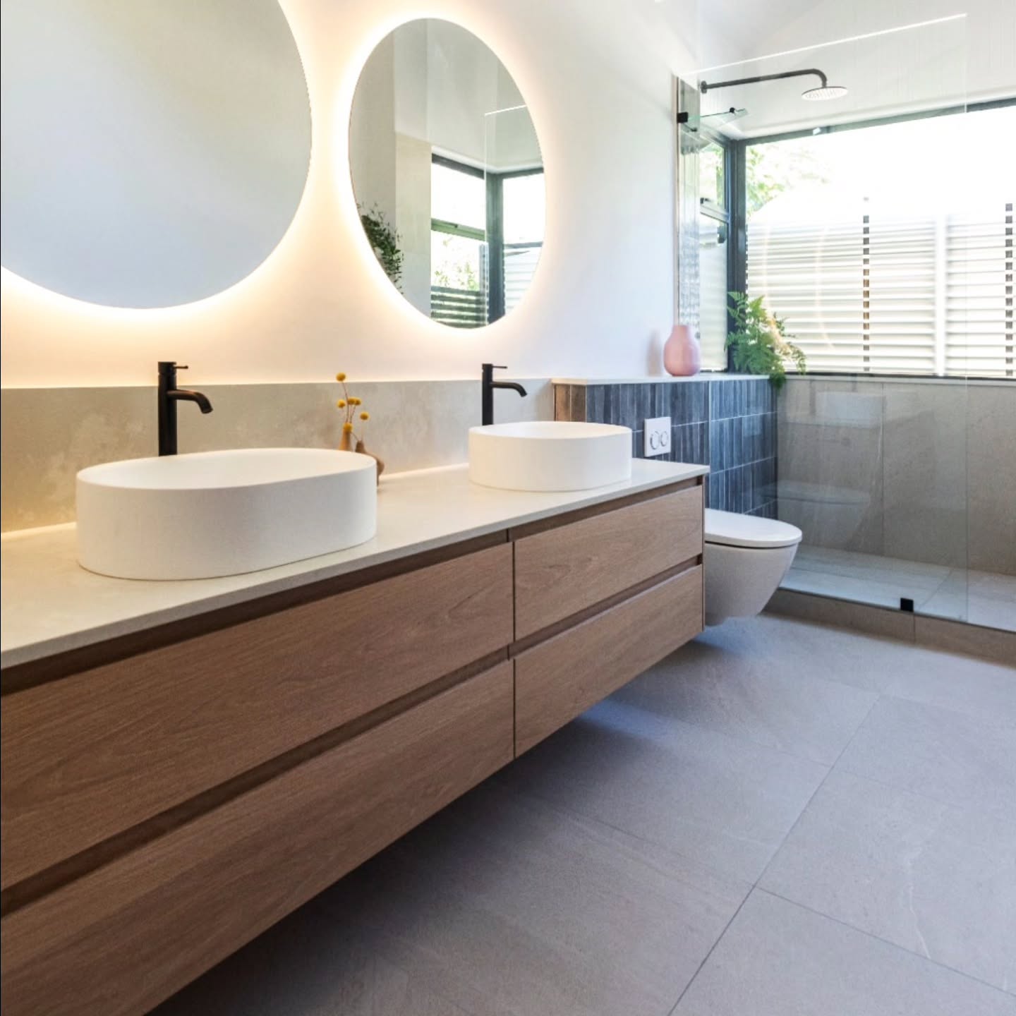 A clean, contemporary vanity featuring oak joinery with elegant reverse finger grip fronts for a seamless look.
The EQ Misty Pearl leather-finish countertop adds a soft, matte texture that complements the natural tones beautifully.
Bathroom design @bespokebathroom
Professional pictures @madrabbott
#OakVanity #ReverseGripDrawers #EQMistyPearl #LeatherFinishStone #ModernBathroom #CustomJoinery #NaturalWoodFinish #BathroomInspo #InteriorDetails #VanityDesign #BathroomGoals #MinimalStyle #ScandiBathroom #WarmNeutrals #TexturedInteriors #ContemporaryBathroom #FloatingVanity #CleanLines
#bathroomdesign #CamiInteriors