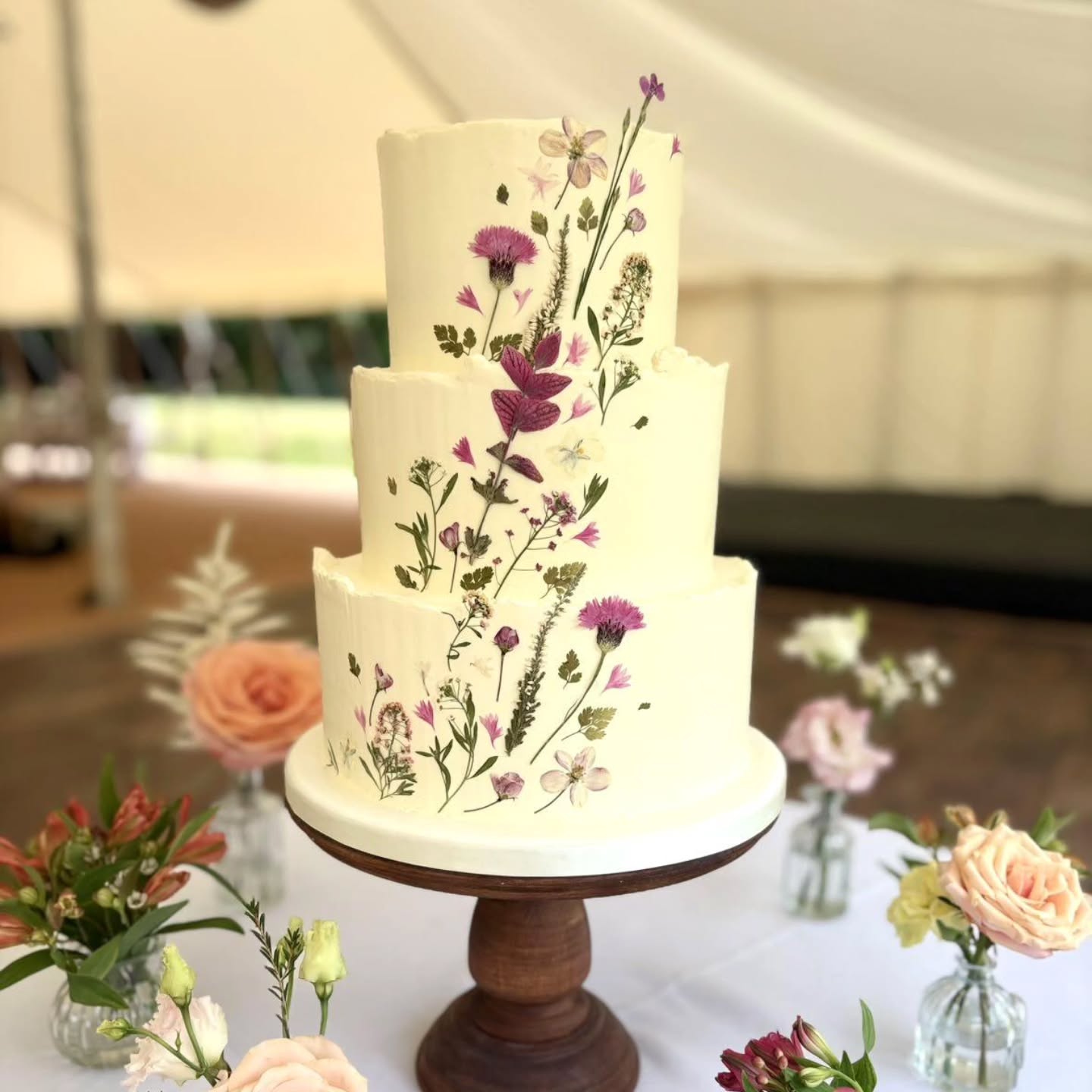🌸Nature meets buttercream in this floral wedding cake dream🌸
A beautiful cake crafted by the talented Claire of @caked.patisserie - decorated with our pressed flowers - Cornflowers, Heather and soft pink Crabapple blossom.
A sweet celebration of love, art and nature's finest.
#weddingcakes
#weddingcakeflowers
#pressedflowers
#buttercreamcake
#edibleflowercake
#edibleart