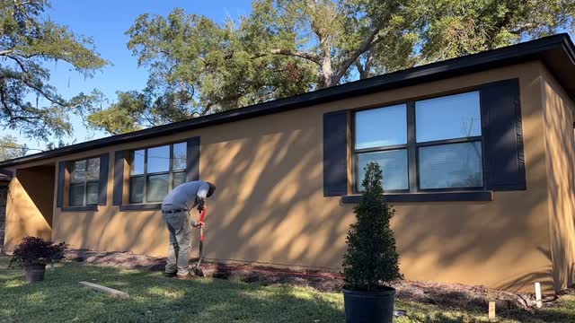 Doing the groundwork for a wall to be installed.