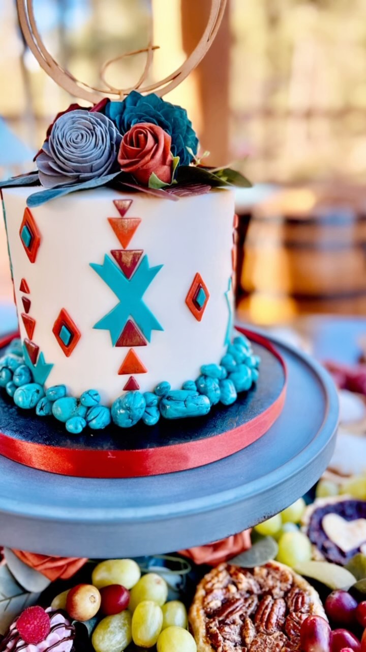 Congratulations to Cassie & Jon!
We are thrilled to say that we were able to a part of the union of this beautiful couple who tied the knot at the breathtaking Cabins on Strawberry Hill in November 2023!
Dessert grazing tables are all the rage these days and we just love creating them for our couples! We especially loved this one for Jon & Cassie, it was an absolute showstopper! A stunning southwest themed spread that left everyone in awe. Handmade pies and cookies that melted in your mouth, offering a delightful taste of homemade goodness. And oh, the cupcakes! Among them, the jalapeno carrot cupcake with a cayenne cinnamon infused cream cheese buttercream topped with a candied jalapeño that added a touch of spice and sweetness. It’s an explosion of flavors that make your taste buds dance with joy!
Fresh fruit, vibrant and refreshing, added a burst of color to the table, perfectly complementing the southwest vibes. But the highlight, without a doubt, was the DIY cannoli platter that allowed guests to create their own sweet masterpieces. And let’s not forget the pièce de résistance: a majestic southwest themed wedding tier, adorned with all-edible decorations, including the mesmerizing turquoise accents. It was truly a work of art that tasted as good as it looked!
Cassie and Jon, we feel privileged to have been a part of your love story. May your journey together be filled with endless love, laughter, and beautiful memories.
Once again, congratulations to the newlyweds! 🥂✨
#CassieAndJonWedding #DessertGrazingTable #SouthwestTheme #WeddingTier #EdibleArt #Deliciousness #LoveAndCelebration #paysonazbakery #arizonabakery #kendras_country_bakery