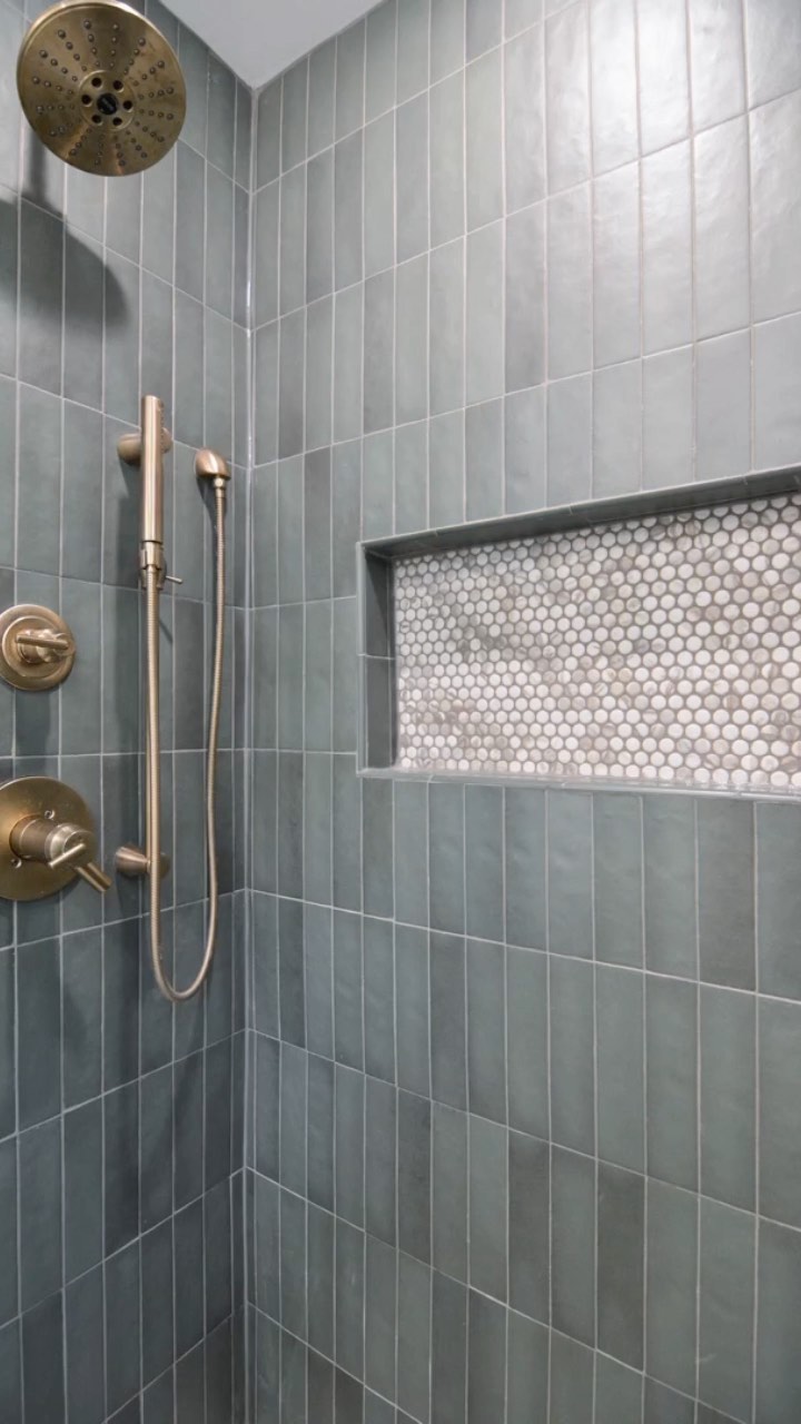 Expectations for these green tiles 👇
We are obsessed with the outcome of this stunning bathroom, but a few things to note when it comes to these highly sought after green tiles…
1. These are handmade tiles and are not made to be impeccable. So if you’re looking for perfection, this may not be the tiles for you.
2. The installers may take more time to install these beautiful tiles because they’re ever so slightly varied in sizes.
3. There’s a substantial variation, which gives it a dimensional look when installed, but if you’re looking for consistency, I’d recommend looking for a different tile.
The overall look make these tiles SO worth it.
It brings a warmth to the space and even though it is on the darker side, it’s not overwhelming either!
#smallbathroomdesign #smallbathroomideas #greentiles #showertile #floatingvanity
