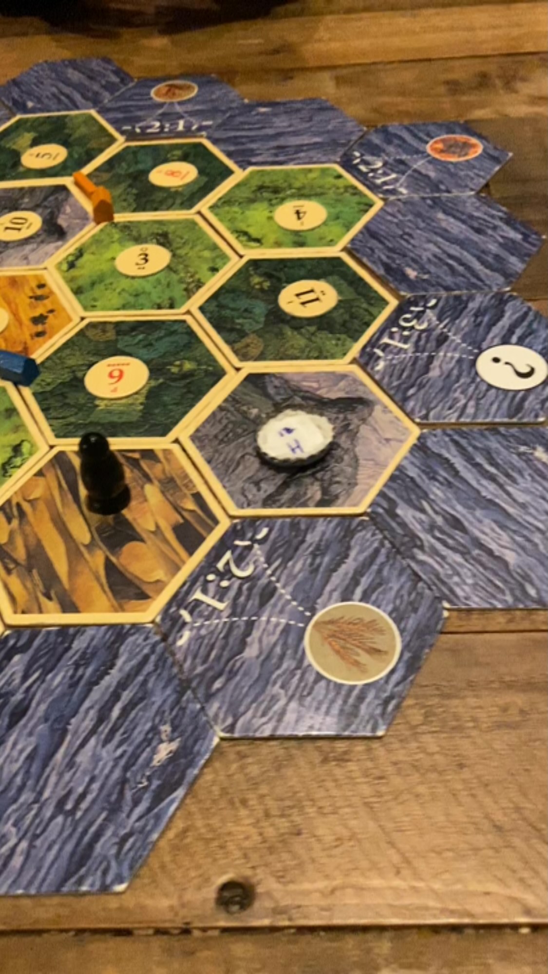 This is my OG #settlersofcatan board from over 20 years ago. Yes, one of the number tokens has been replaced with a beer bottle cap.