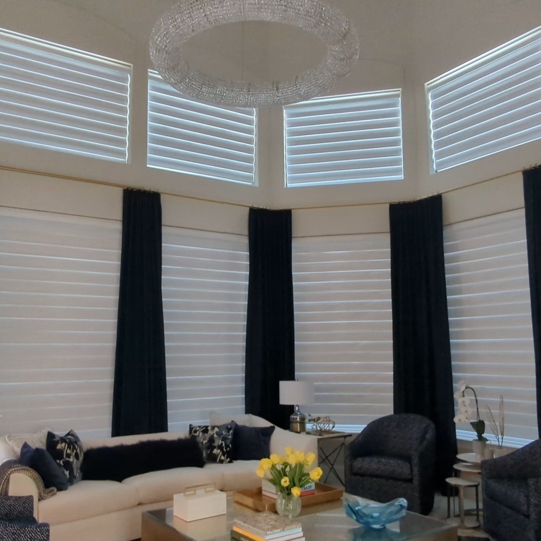 Automated shades revealing a beautiful view.