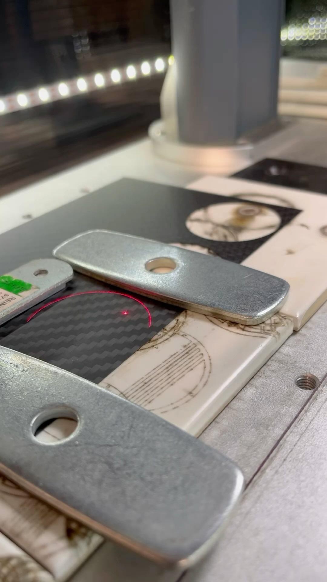 Bespoke watch build by Nadeau Watches - made from carbon fiber and abalone shell, and with a truely unique coloured mechanical movement visible through a glass caseback