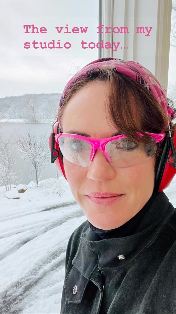 It was one of those magical days where snow hung on every branch, the world seemed safely blanketed, and I kept stopping, lifting my welding helmet, and staring out the window.