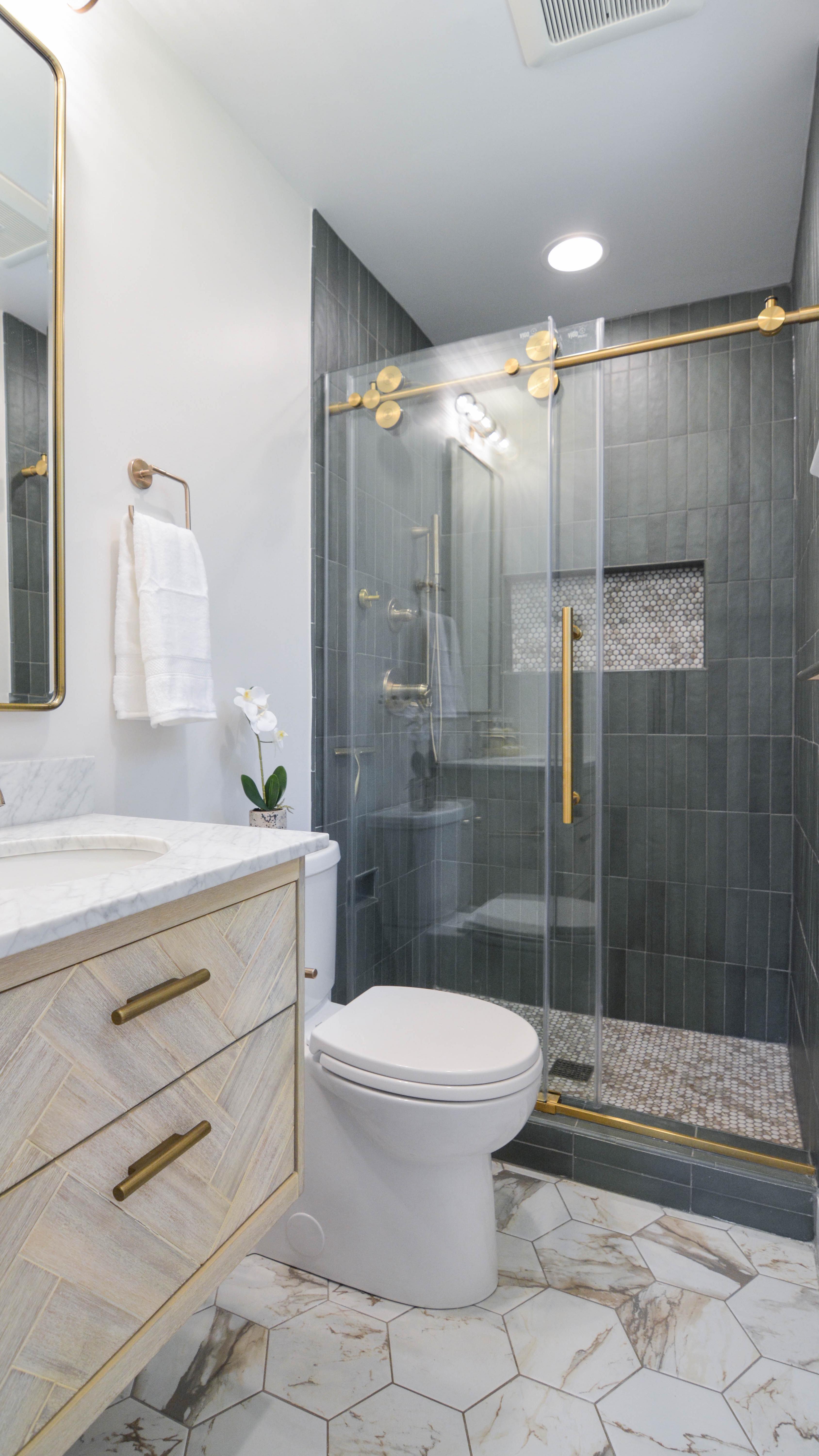 Emerald & Gold 😍
These clients really trusted me with their selections, even when we went with a moodier tile for their shower.
They were a little worried it would darken the space but as you can see, it still feels quite bright because the rest of the selections are so much lighter.
And since we were working in a tighter space, we chose a floating vanity and a compact toilet to free up the footprint.
#primarybathroom #smallbathroomideas #greentiles #greenandgold #smallbathroomdesign #floatingvanity