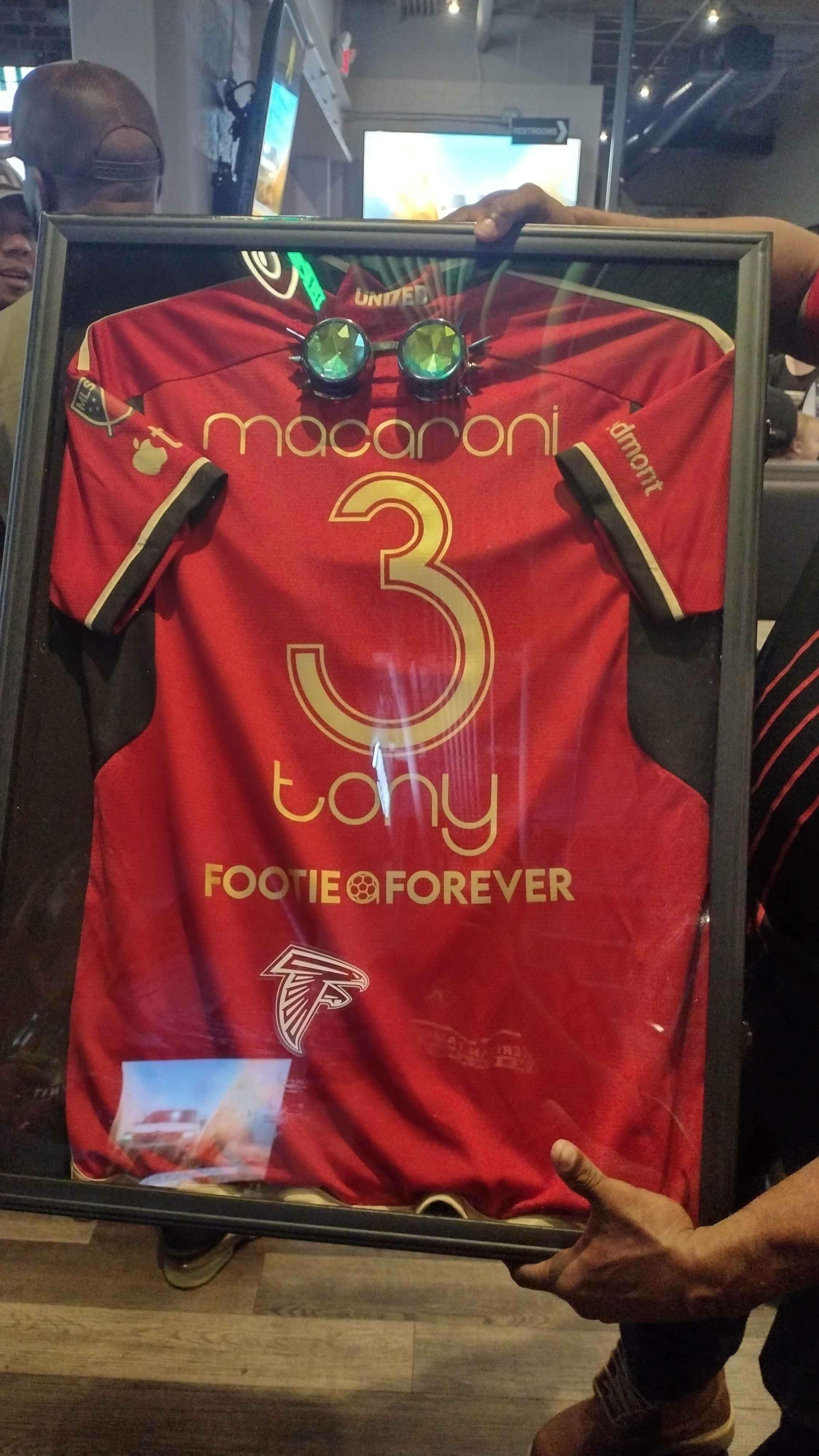 Firstly, we want to thank @footiemob for allowing us to pay tribute to Tony in this way. The appreciation we received from the group, and especially Tony's mother and family is all the payment and reward we needed.
In the immediate days after Tony's death, we were flooded with overwhelming thoughts. Not understanding how could this man meet his end the way he did. Not understanding how someone that would meet everyone he came across with a smile and joke would meet someone with such violent and cruel intentions.
None of it makes sense.
But life has taught me, some things do not make sense. Sometimes, it just... is, exactly what it is.
But if you're able to, you appreciate the time you got and pay tribute however you can.
Which led us to this.
We mentioned a few weeks ago the 404 Kit nameset we designed for Tony a year ago, something that Tony kept saying he wanted to get done down to the last conversation we had with him. The original plan was to get that made (and I do believe that's still coming pretty soon). Turned out Footie Mob had a 17s jersey available and without even thinking I knew what I wanted to do.
Tony may not have started on Day 1 with Footie Mob but if there was anyone that embodied the spirit of Footie Mob, it's Tony. At tailgates, during the games as capo, and the post game let outs, his energy, his flavor, his charisma. He carried all that in spades. He wasn't the biggest man, but his vibes were big enough that they could fill Stone Mountain up. And I know we will miss all of that and then some.
He was a Footie Mob Man. He is Footie Forever.
This coming Saturday will be a special night and we're so glad Tony will be able to see us turn up for him one more time this season.
#explore #endgunviolence #atlanta #atlutd