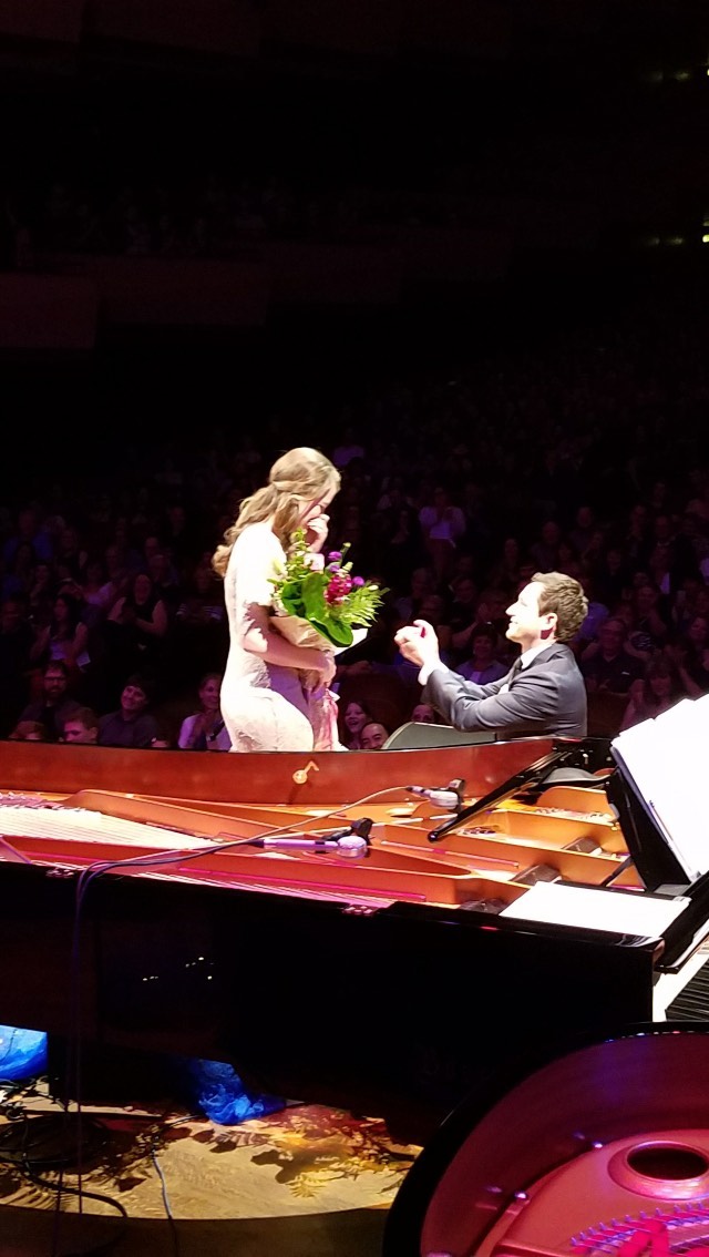 If you haven’t yet seen this side of my husband, David Cate, you’re in for a TREAT! And I get to do this because…
✨🥳🎊TODAY is his BIRTHDAY!🎉🎈✨
David doesn’t like the spotlight, but he made a very special exception five years ago. He decided to surprise me and propose on stage at Benaroya Hall, which seats over 2,200 people!
Immediately following my performance during the show, my own Prince Charming appeared with a dashing grin, a stunning bouquet and a beckoning hand as he led me to center stage. David, you delivered your proposal with such poise and love that night, and those moments are forever engrained in my memory. (Plus…you quote Mr. Darcy so well! *swoon*) I hope that by sharing this video, everyone can share in this timeless moment. (LMK in the comments if you were there with us too!)
And you also gave many people a precious memory as well, including many of our dear family and friends! In fact, I *still* have people coming up to me at the piano when I play and say that they were there that night at Ten Grands!
SO, today on your BIRTHDAY, I want to take this moment to wish you a very HAPPY BIRTHDAY, and to show you off!! That night, YOU were the STAR of the show at Benaroya Hall! You did an amazing job, and it’s such fun to share this facet of you for those who haven’t seen it yet, or who want to see it again!! 😁
But truly David, you’re a star every day. You never cease to surprise and inspire me. I celebrate your daily boldness, your drive to reinvent yourself, and especially your genuine Christlike love. You’re quick to help others, and to give and to serve wherever you see a need. You set a wonderful example for many to follow, including me!
Happy Birthday, Honey. I love you!
P.S. For months, David had secretly arranged all the details behind the scenes with the amazing team of TEN GRANDS SEATTLE, who generously wove this surprise into their May 2018 program! I also want to express my thanks once more to Michael Allen Harrison, Steve and Kathy Dewalt, Greg Tamblyn, Peter Van Houten and so many others who contributed to this moment! What a treasured memory!
HUGE THANKS to @sarajreed + @arthurmigliazza for the vid and pic!