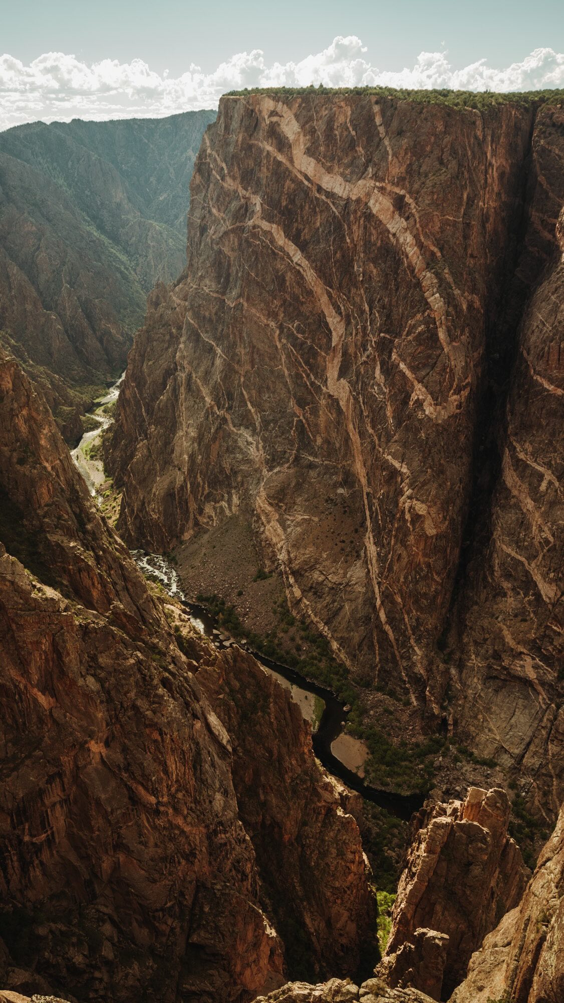 If you ask me, this was a no brainer. I mean, it was literally in the name!
—-
Did you know?
Black Canyon of the Gunnison gets its name from the lack of sunlight that is available within the canyon and not by the apparent color of the walls. In fact, some places within the canyon receive as little as 33 minutes of daylight EACH DAY. 😳
And as for the colors of the canyon…you can thank rock layers of gneiss, schist and pegmatite. They make up the craggy cliffs and streaking patterns across the cliff side. I should add, Painted Wall is the tallest cliff in Colorado at 2,250 feet. The Empire State Building is just over half the height of this cliff!
Come follow us @wherewildonesroam for more insider tips, tricks and recommendations for exploring US national parks with kids!
📸: Painted Wall from Painted Wall View at Black Canyon of the Gunnison National Park
#nationalparkswithkids #blackcanyonofthegunnison #nationalparksusa #bcgnp #blackcanyonofthegunnisonnationalpark #paintedwallview #didyouknow #familytravel #geologyrocks