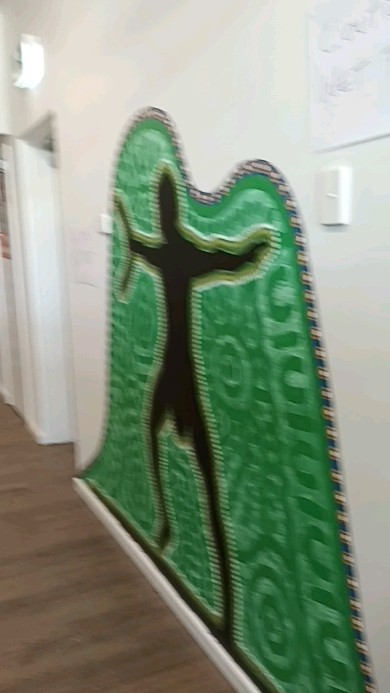 The entrance mural at Active Kids Mount Gravatt represents the Welcome to Country dance as we all share and take care of this land. The mural depicts him welcoming all that enter the centre.