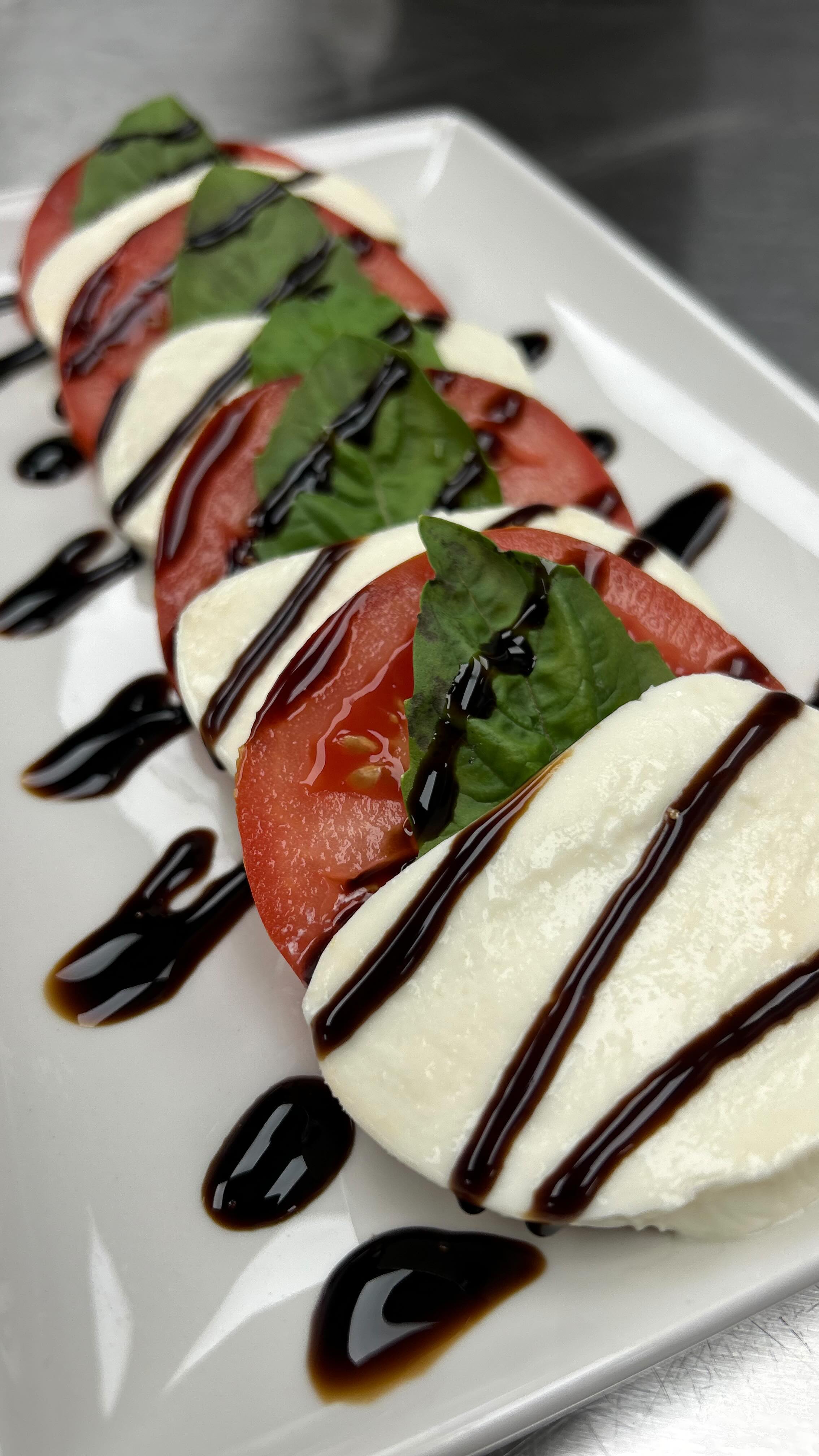 Cool Down at Smoke’s Bistro with our New & Delicious Tomato Caprese Salad Now Available $12. #smokesbistro #restaurant #salad #tomato #mozzarella #basil #balsamic #refresh #fresh #delicious #refreshing #summer #summertime #summervibes #food #foodie #foodblogger