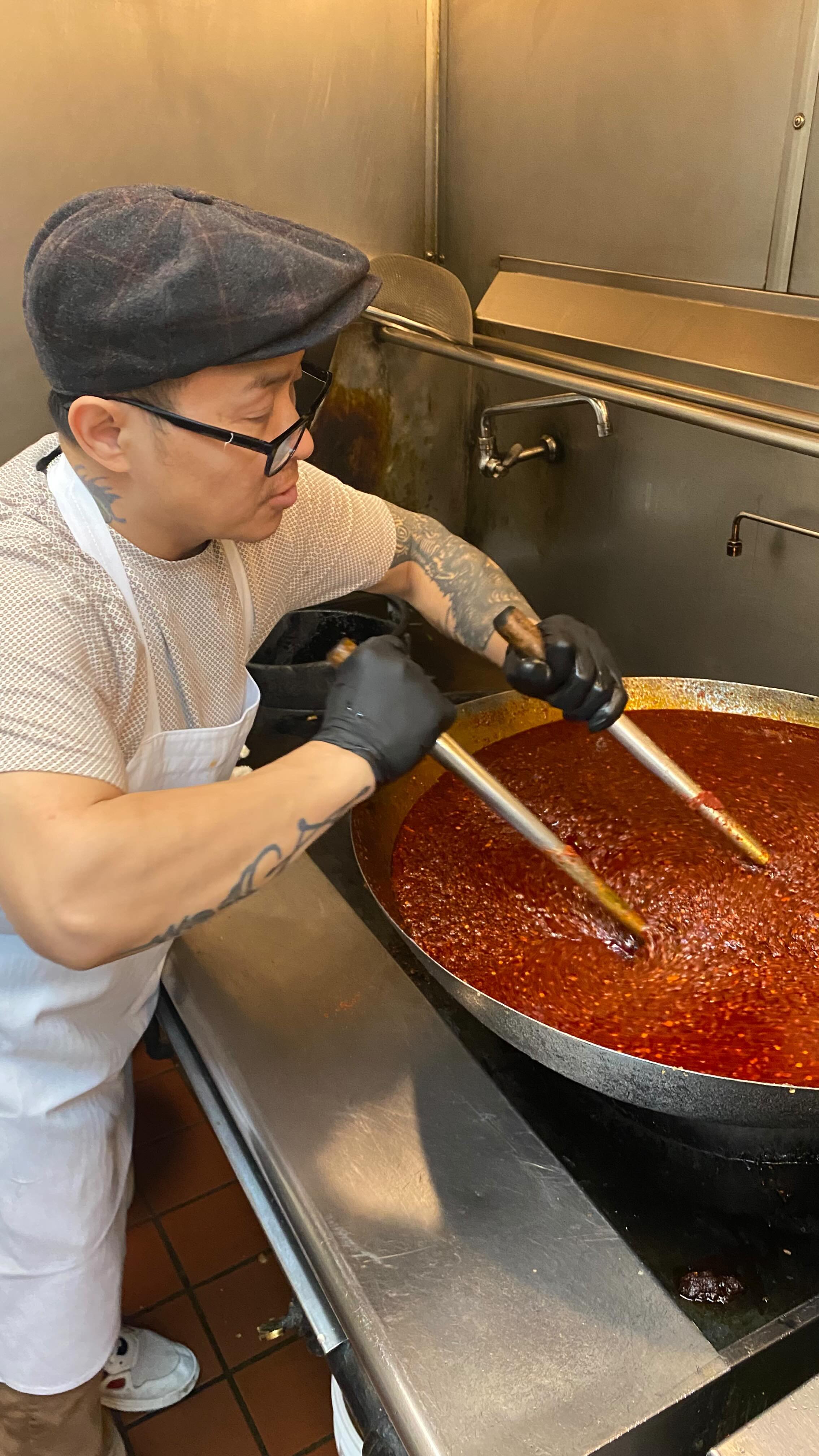 Ever wondered how we make our signature Jeow Bong sauce? Chef Lo and Chef Vanna (dad and mom) come in on their off day to prep. The sauce is piled high with key ingredients such as sundried Thai chilies, galangal, and garlic then simmered for hours until reduced for maximum flavor. Chef Lo keeps a close eye on it, stirring so that it doesn’t burn and ensuring the batch is cooked evenly. The result is a thick chili paste packed with tons of flavor and a side of heat! It pairs well with sticky rice, meats or any of our street eats as a dipping sauce and we also infuse it into our Jeow Bong Noodles or Jeow Bong Fried Rice!
#sweetbasilmke #jeow #jeowbong #jeowbonglife #jeowbongallthethings #kitchenprep #chilioil🌶 #laofood #laofoodmovement #chilicrisp #laosauce #restaurantlife #milwaukeefoodie #mkefoodies #howitsmade #uglydelicious