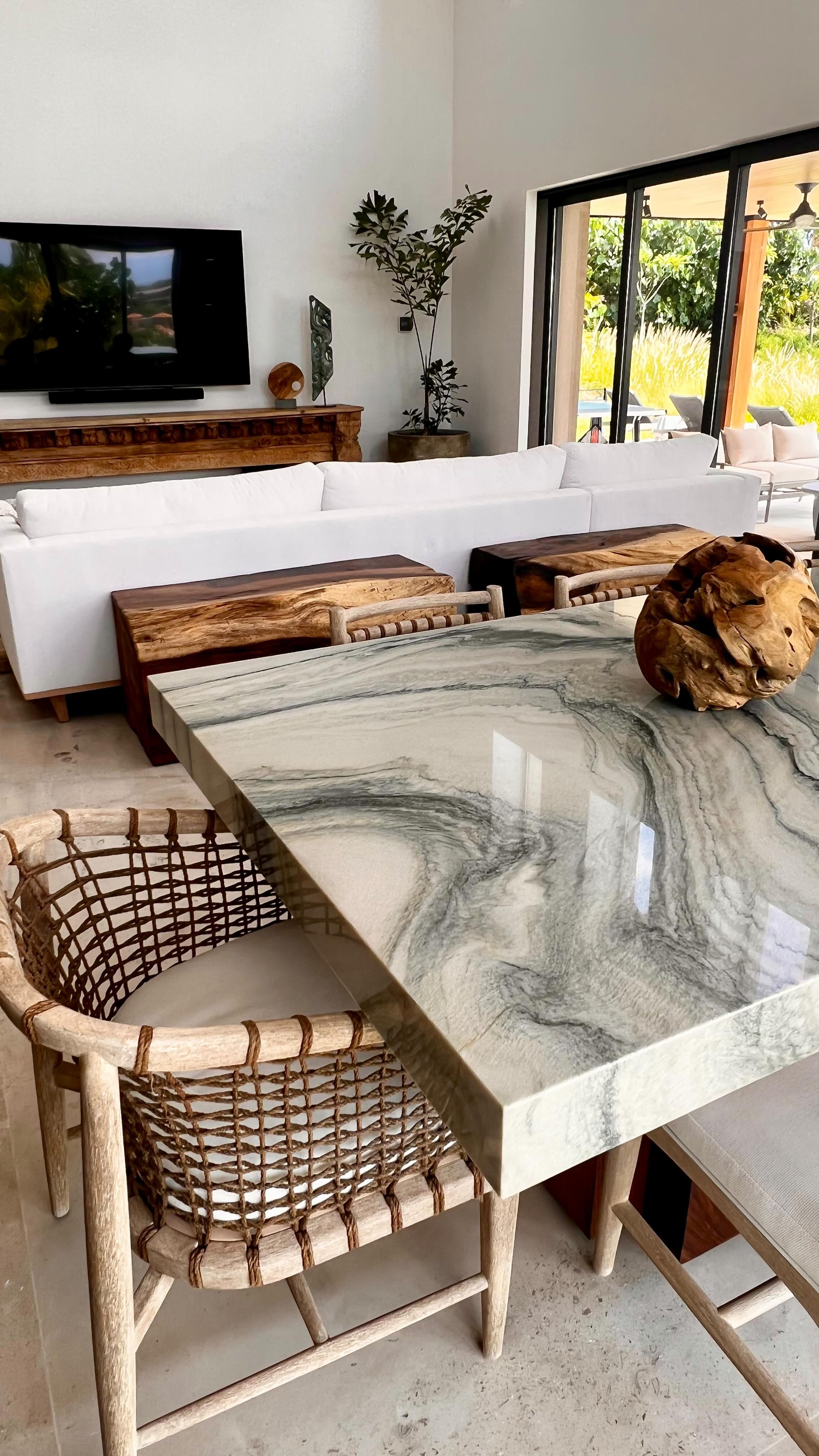 We found the perfect natural stone to make into the perfect custom pieces at Casa Mar y Cielo! 🌊
In the beginning stages of our design process, we knew we wanted to incorporate some custom furniture with a stone that felt like the beautiful coastal azul waters.
During one of our first site visits in Mexico, we found a local slab yard where we were able to hand-select this blue macaubas quartzite. Talk about gorgeous!!!🤩
We returned to the office incredibly inspired to start designing these custom pieces and we could not be happier with how our vision came to life!
Local fabricators did an incredible job executing the custom dining table, the dry bar area, and the coffee table you see here.
Our clients are beyond happy with the outcome of these pieces, and we are so excited for all those who will enjoy them in the future. Custom designs are so satisfying!🍸