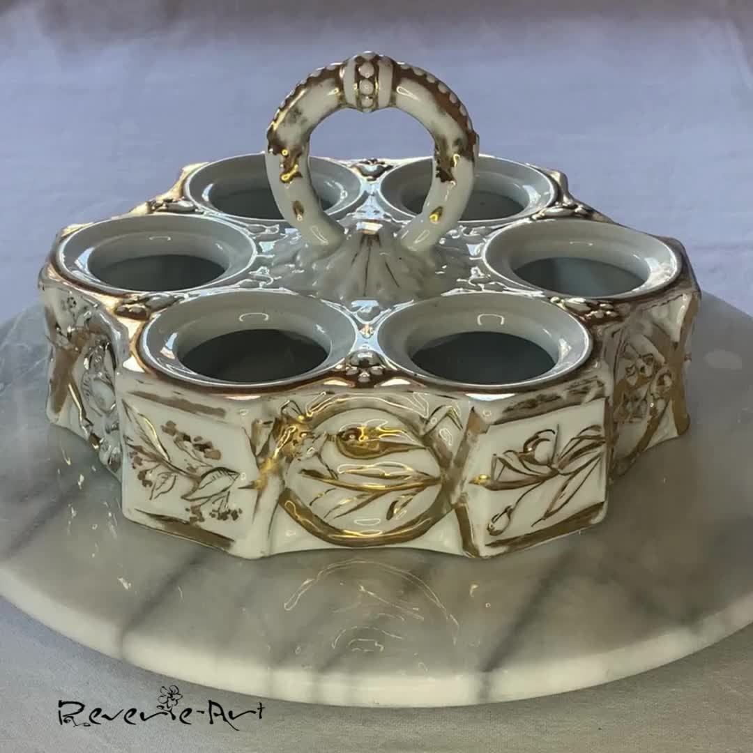 Add a touch of elegance to your home with this Beautiful Victorian porcelain egg stand! Perfect for collectibles, this stunning piece showcases gilded patterns with a spring theme. Only one available! Link in Bio. #InstaDecor #VictorianStyle #PorcelainEggStand