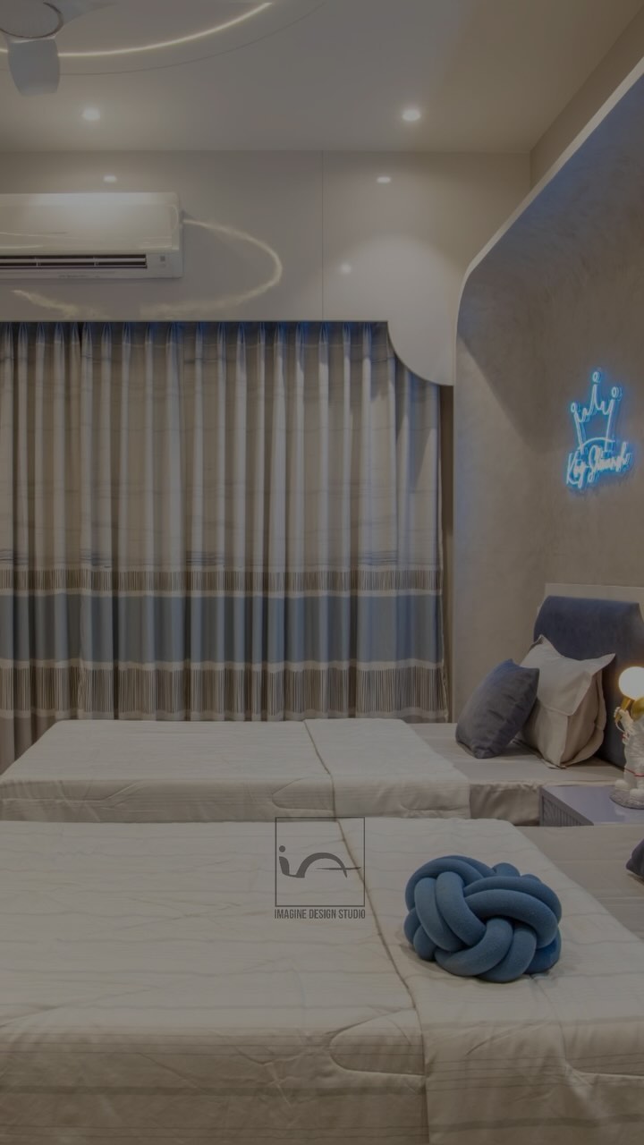 “Sibling harmony meets serene sophistication in this stunning shared bedroom retreat!
Twin beds adorned with plush grey and blue linens, perfectly symmetrical and inviting.
Curved back panels add a touch of softness and visual appeal.
Separate study tables and bookshelves for each sibling, fostering independence and a love for learning.
A calming grey and blue color scheme, promoting relaxation and tranquility.
A shared space that encourages bonding, yet respects individuality….
This beautiful bedroom haven is where memories are made, and sibling love grows stronger every day…!!!!
.
Designed @imagine_design_studios @architect.ankitmittal
Design team - @ar.deepesh_sharma @chandrikamittal
Location- Dahod, Gujarat !!
@sanket.sanket1988 @sumit_agrawal90
.
.
#SiblingGoals #SharedBedroom #GreyAndBlue #BedroomInspo #KidsBedroom #StudySpace #BookLovers #SereneSanctuary #kidsbedroom #kidsbedroomdecor #kidsbedroomideas #kidsbedroomdesign #interiorstyling #twinbedroom #interiordesign #indorearchitects #instadaily #interiordesigner #architecture #reelsinstagram #luxuryinteriors #explorepage✨