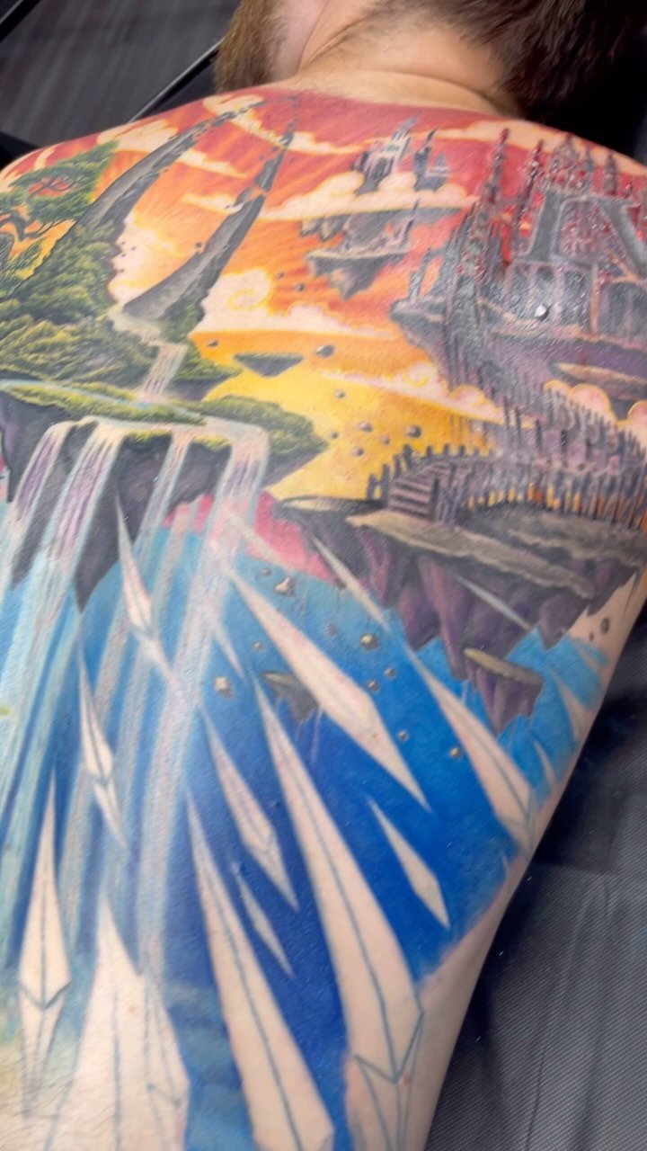 Hove you been following the progress of @bjardinked ‘s bodysuit? This fantasy scenery is based on the art of @magicthegathering artist @johnavonartist. ✨ sometimes it can be challenging to work in the style of another artist, but John is definitely working from a very familiar imaginary realm. Not only is this one of my larger projects, it’s one of my favorites.