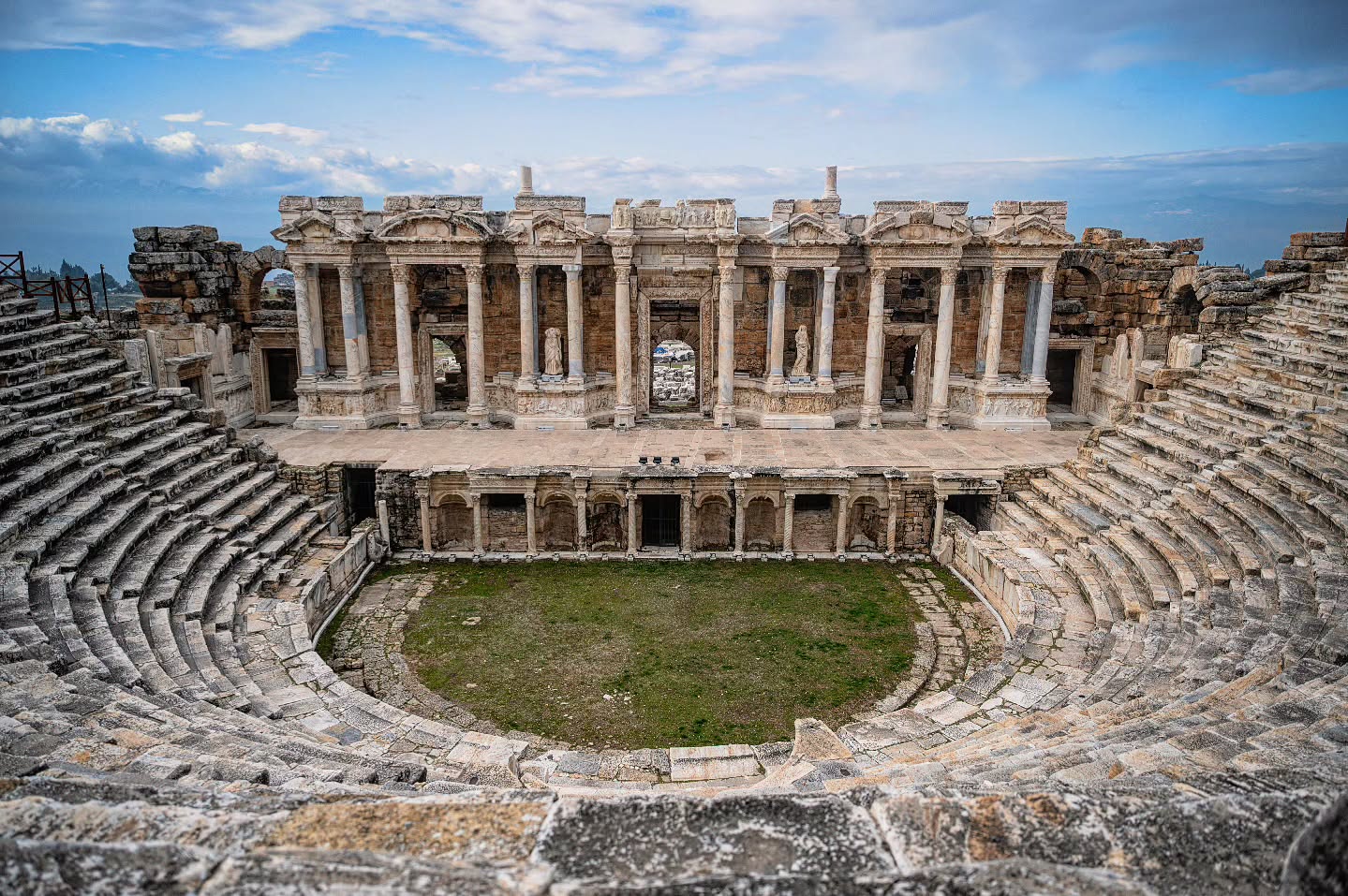 High above the shimmering travertine pools of Pamukkale, the ancient theatre of Hierapolis stands as a masterpiece of Roman engineering. Its stone tiers once echoed with cheers and music, and today, it offers a stage for history framed by sweeping mountain views.
#Pamukkale #Hierapolis #AncientTheatre #PamukkaleTurkey #RomanTheatre #HistoryLovers #AncientRuins #TravelTurkey #TurkeyTravel #HistoricWonders #WorldHeritage #AncientArchitecture #EpicViews #ArchaeologyLovers #TravelBackInTime
