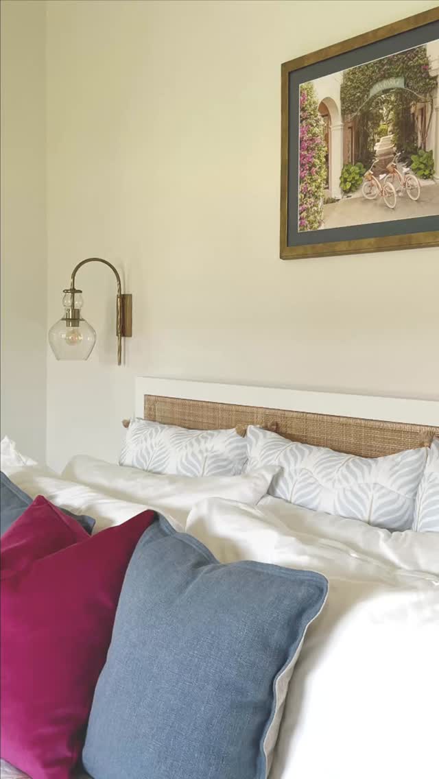 Welcome to this dreamy guest retreat 🌺Inspired by the Gray Malin artwork, this room is designed to feel like a charming escape. 🚲The serene palette of soft blues and layered neutrals creates a calming foundation, while bold pops of fuchsia bring the same vibrancy you’d find strolling through bougainvillea-lined pathways.
A woven headboard adds warmth and texture, complemented by modern touches like the sleek wall sconce and gold-accented nightstand. The cozy patterned rug grounds the space, making it both inviting and stylish.
Perfect for guests who want to feel like they’re on vacation—even if it’s just down the hall #palmbeachstyle palmbeachstyle #palmbeachcounty #palmbeachinteriors #interiordesign #palmbeachdesigner #GuestBedroomGoals #GrayMalinInspired #TravelInspiredInteriors #InteriorDesignLovers #BedroomInspo #ModernCoastalStyle #ColorPopInteriors #ChicAndSerene #HomeDecorDetails #DesignWithArt #StyledSpaces #InteriorDesignCommunity #DecorCrush #InvitingInteriors #vacationvibesathome