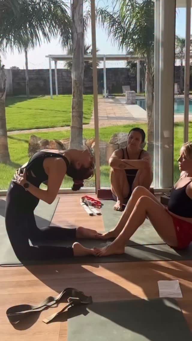 Sharing some of the ways I like to guide students towards working into Kapotasana in classes and workshops.
I always try to keep the focus on lifting up to go over — I’ll often say, “imagine there’s a high jump bar behind your back, and you’re trying to go up and over it.” That sense of lift and extension in the spine comes first, before going backwards.
I also bring attention to the hips — finding hip extension and pushing forward to go back — and to keeping the elbows in, which helps support external rotation in the shoulders.
Rather than just pushing someone deeper into a shape, I like to see how much they can find for themselves first. Even with adjustments, my goal is to help them discover activation, not just reach their end range.
For example, here with Deborah @deborah.pedrazzi towards the end I’m taking my hands to her hips and cueing her to push me up — creating length and space before moving deeper.
The last day of our #alofurryfriends challenge 💜🙏
#CamelPose #Kapotasana #CamelPoseTutorial #Backbend #FlippedGrip #AloYoga #BackbendTutorial #BackbendPlay #YogaPractice #YogaTeacher #YogaAdjustments #HeartOpener #DeepBackbend #YogaWorkshops #YogaJourney