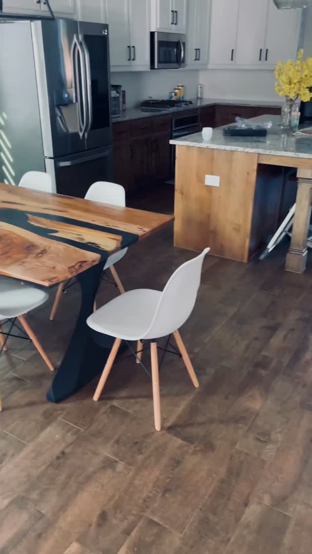 Pecan live edge wood transformed into a black epoxy table built to last and create countless memories. The elegant legs from @flowyline_design perfectly complement the warm aesthetic of this piece. #liveedge #customfurnituredesign #timeless #artresin