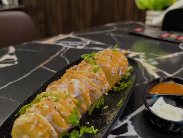 Craving something crispy? Indulge in our Signature Potato Twister with Red Sauce at THE CHINGGS CAFÉ #potatotwister #crispy
