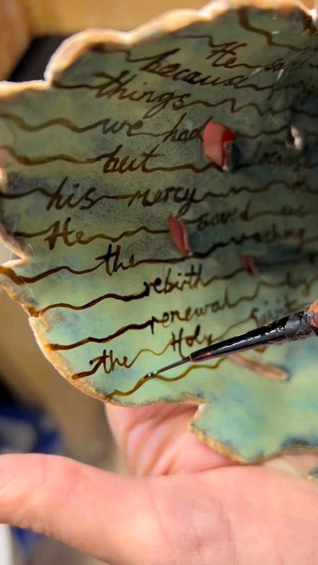 Autumn has settled in, leaves gently tumble from the trees outside. The studio is chilly but I’m wrapped up warm and carefully finishing this leafy sculpture. I go over each line with my tiny brush to be sure that the gold pops and doesn’t burn away in the kiln. Trying hard not to falter and feel confident about the lines I make.
Building this sculpture out of individual leaves was methodical, but this is my final challenge. I love spending time pondering the words as I write them and considering the meaning of the sculpture.
#sculpture #ceramicart #ceramicstudio #ceramicsofinstagram #golddetail