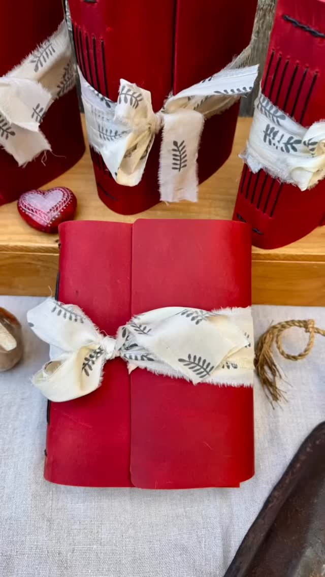 New!!! LARK in the MORNING STORYTELLER
~a journal with a folkloric soul
Bound in rich country red natural leather and tied with hand-dyed sari silk, Lark in the Morning carries a timeless, folkloric charm. 
Within its pages, red petals and blackbirds ~ each silkscreened onto handmade lokta ~ dance across the paper like verses of an old song.
There’s a sense of heritage here ~ of craft passed down through hands and hearts. Every turn of the page invites story, memory, and imagination to mingle, like morning light filtering through a cottage window.
A Storyteller for those who love the honest beauty of handmade things and the quiet poetry of everyday life.
#LarkInTheMorningStoryteller #HypatiaBookArts #FolkloricDesign #LeatherBoundJournal #FindYourStoryAtHypatia #VineyardArtisans #OneOfAKindGift