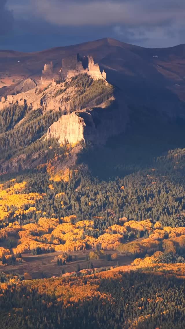 Mesmerizing play of light and shadow, contrasted with the golden aspens below.