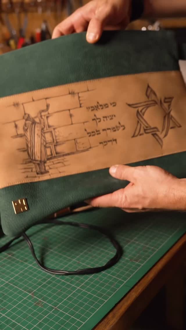 This custom set was designed for a client who wanted something truly one-of-a-kind:
A hand-illustrated design engraved into premium Italian leather, built to carry tradition, identity, and meaning every single day.
This time, we added something new:
A custom-matching leather holster, designed to be mounted inside the bag for seamless carry, or worn independently on the belt like a standard holster. Fully modular. Fully personal.
Every step in this process is done by hand in Israel - from the artwork to engraving, cutting, stitching, burnishing edges, and finishing.
No mass production. No templates. Just craftsmanship, story, and precision.
We believe Judaica should be as meaningful and unique as the moments it represents.
Would you design your own?
Tell me below - what theme or artwork would you choose for your bag?