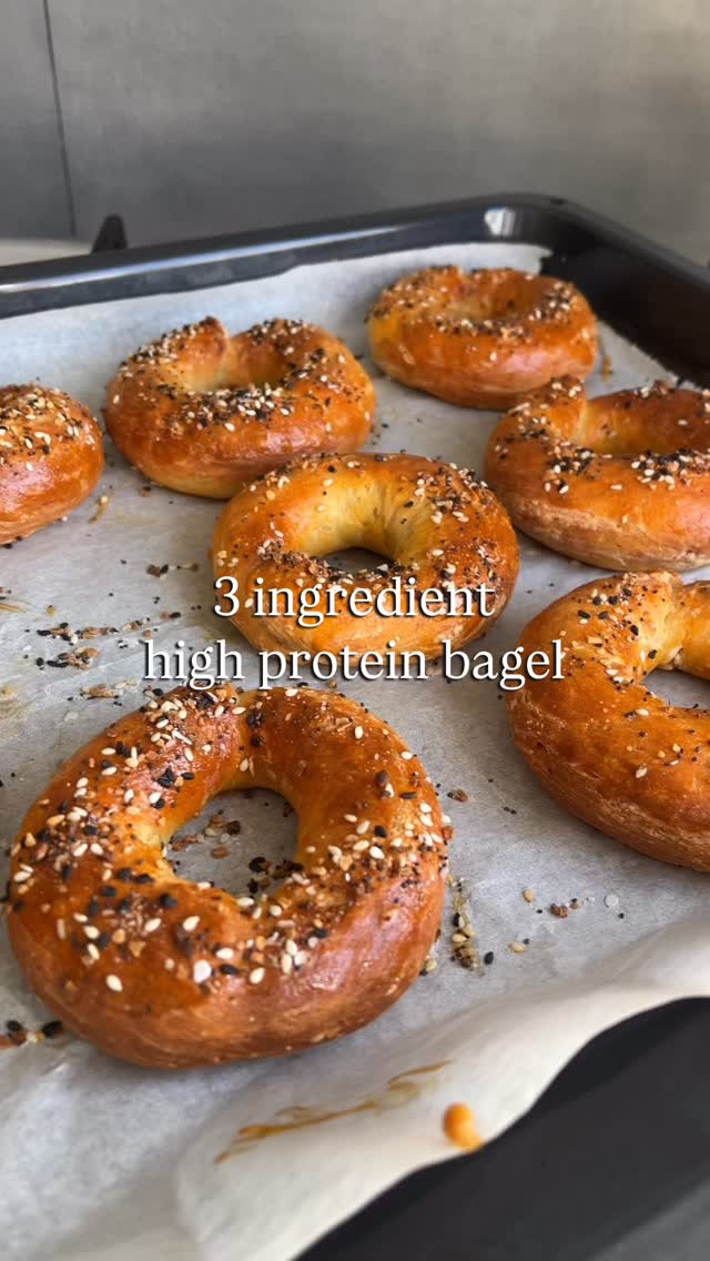 RECIPE BELOW ✨
So easy & sooooo good. Best part, you’ll have most of the ingredients in your cupboard right now.
Ingredients
250g quark or high-protein yogurt (e.g., Greek yogurt)
250g self-raising flour
1 tsp baking powder
Extra:
1 egg, beaten (for egg wash)
Bagel seasoning (e.g., sesame seeds, poppy seeds, pumpkin seeds, or everything bagel seasoning)
And yes, that’s more than 3 ingredients but you don’t need the last two to make the dough 👀
How
1. Preheat Oven to 180°C (350°F) and line a baking tray with parchment paper.
2. In a bowl, mix the yoghurt, flour and baking powder
- combine until a dough forms. Knead for 2-3 minutes until smooth. If sticky, lightly flour your hands.
3. Divide the dough into equal portions, roll into logs, connect the ends to form bagel shapes.
4. Brush with beaten egg and sprinkle with your favorite seasoning.
5. Bake for 20-25 minutes or until golden brown and firm.
These bagels come out soft, slightly chewy and higher in protein than anything you’ll grab at the supermarket.
Save this to your “recipes I swear I’ll make one day” folder, it deserves a spot 🫶🏼🧡