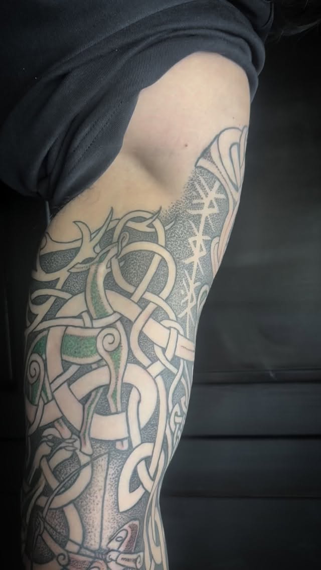 Created this Hiberno-Norse style sleeve that features Ullr, the Norse god of the hunt. My favourite part of this project is this inner part that shows Ullr in pursuit of a deer, with hunting hounds in tow.
-
The style is a hybrid of Irish Celtic knotwork style, with some Norse Urnes-style inspired parts and the Norse mythological matter. I am fascinated by the history of these cultures’ interactions.
-
Thank you to Ryley for sitting so well with me and being such a pleasure to work with. This was his first tattoo, and he decided to go for a full sleeve!
-
#triplegoddesstattoos #hibernonorse #knotworktattoo #dotworktattoo nordictattoo