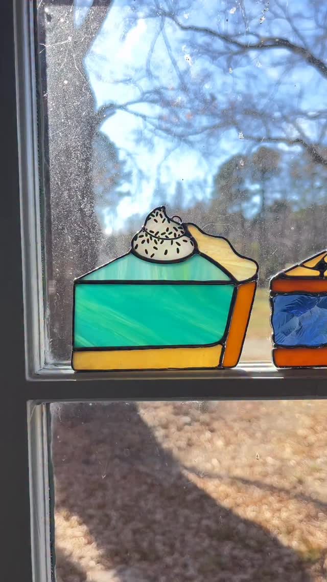 If I seem obsessed with these pies we did lately, it’s because I am 😂 might be a few more posts about them on here! We still have the Baja Blast slice (shockingly to me!) and the lemon meringue 🩵💛 And yes my window is dirty outside, don’t judge me. We are too busy making glass to clean them! #stainedglassartist #stainedglass #bajablastpie #stainedglassart #lemonmeringuepie