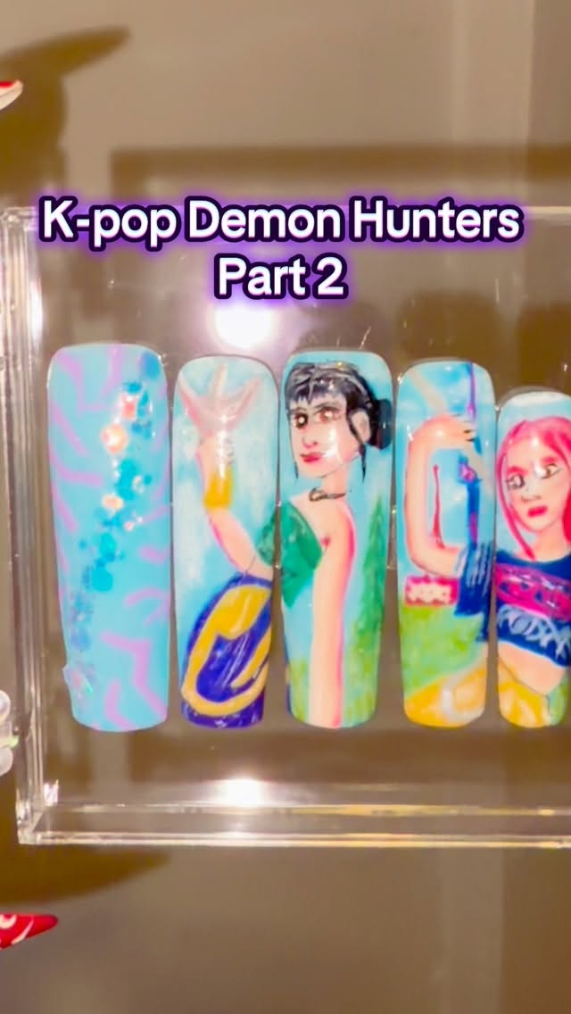 This press on set took me a very long time 😂 but they are finally finished! K-pop Demon Hunters Mira and Zoey with Seoul landmarks in the background #kpopdemonhunters #nailart #handpaintednails #nailsnailsnails #pressonnails #nails #nailartist #handpainted